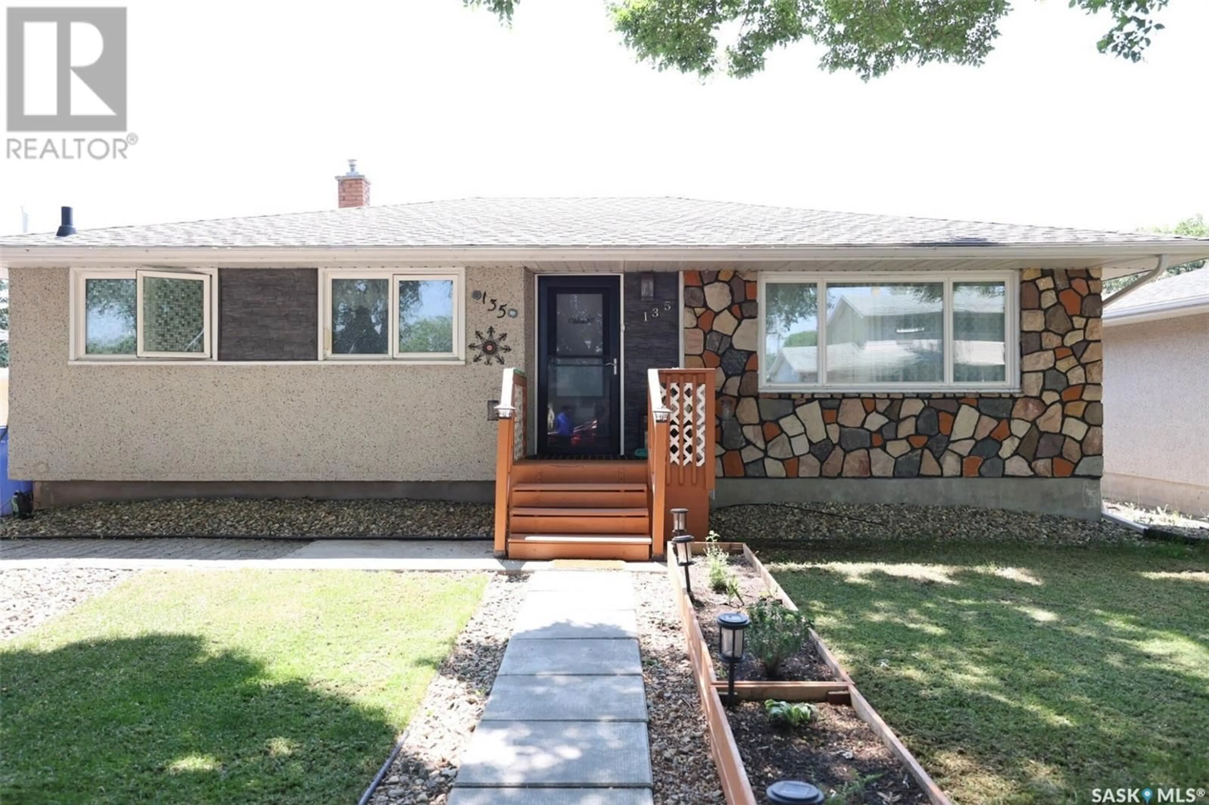 Home with vinyl exterior material, street for 135 WOODWARD AVENUE, Regina Saskatchewan S4R3H5