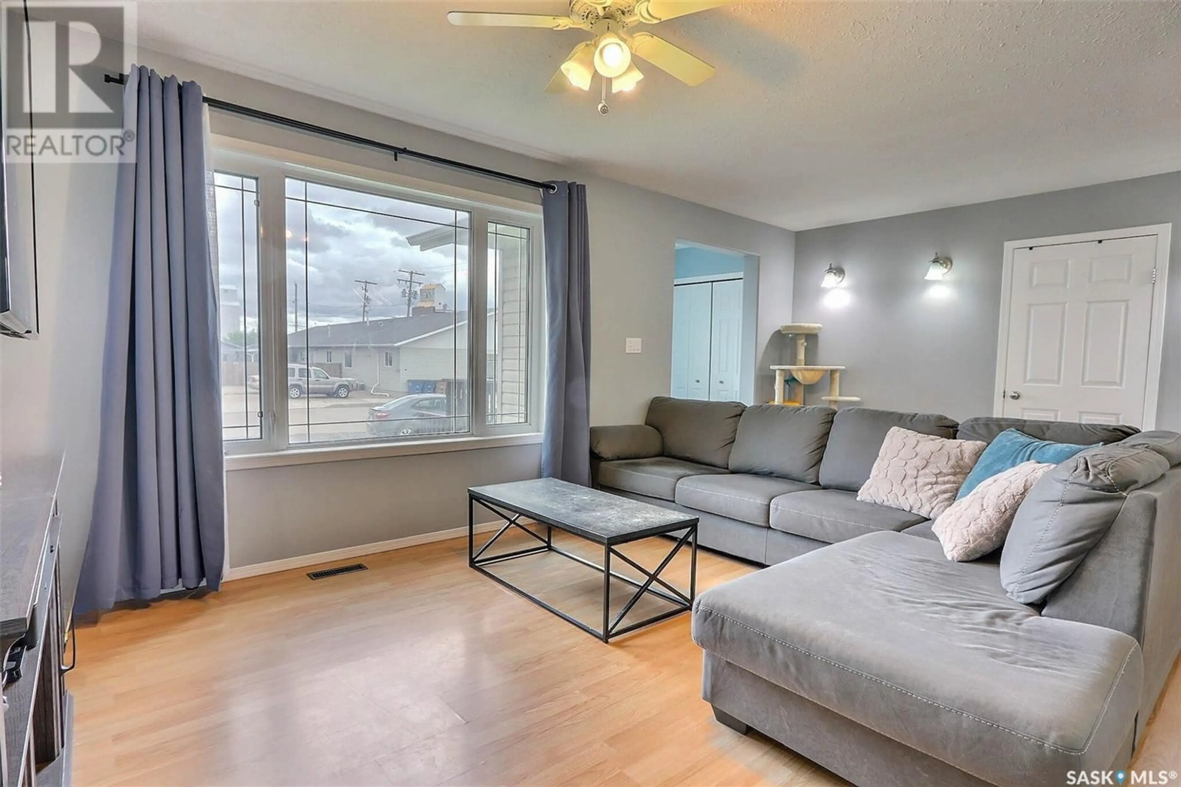 Living room with furniture, wood/laminate floor for 104 1ST AVENUE, Shellbrook Saskatchewan S0J0N0