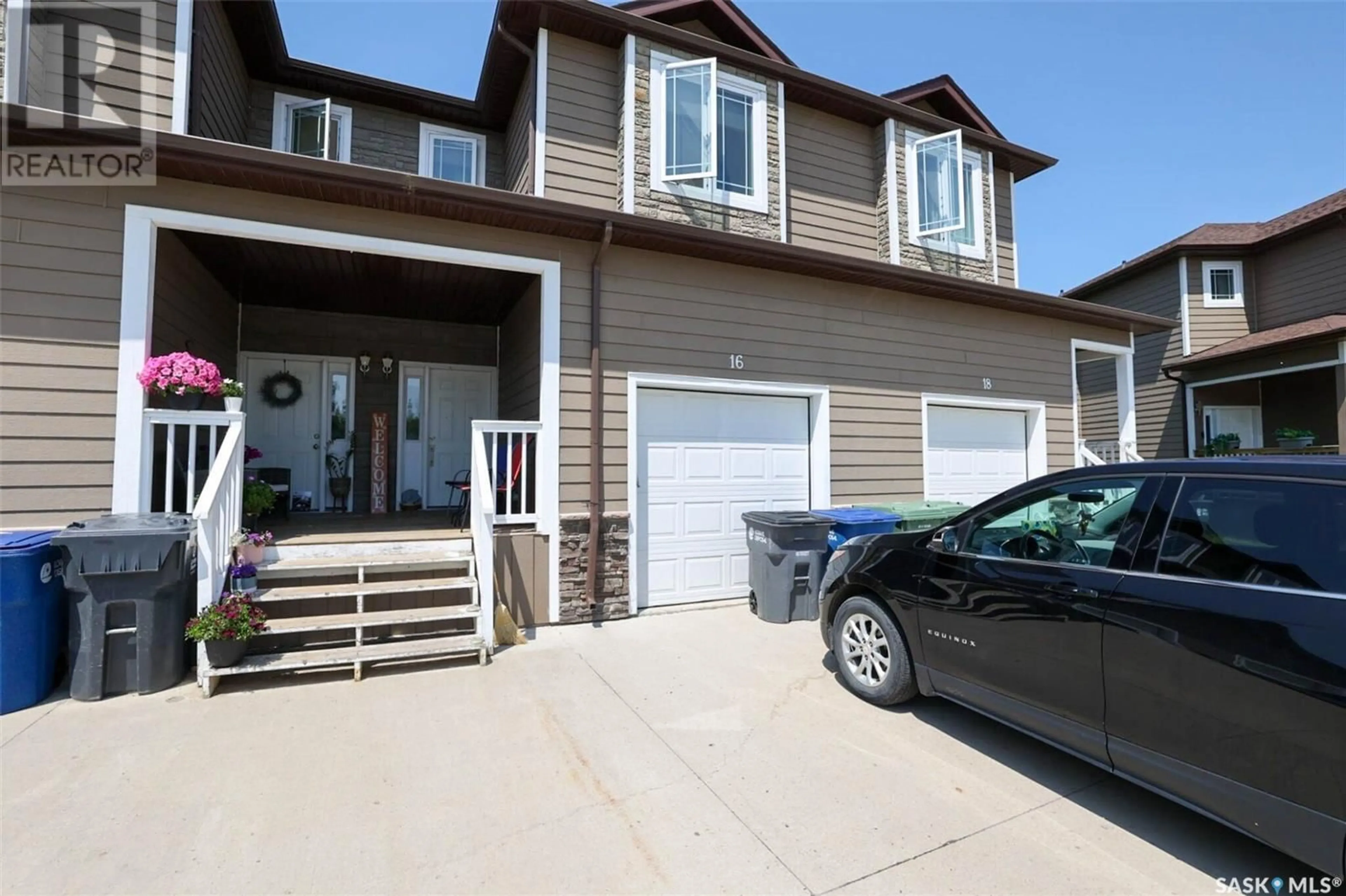 Home with vinyl exterior material, street for 16 MCKENZIE LANE, White City Saskatchewan S4L0B2