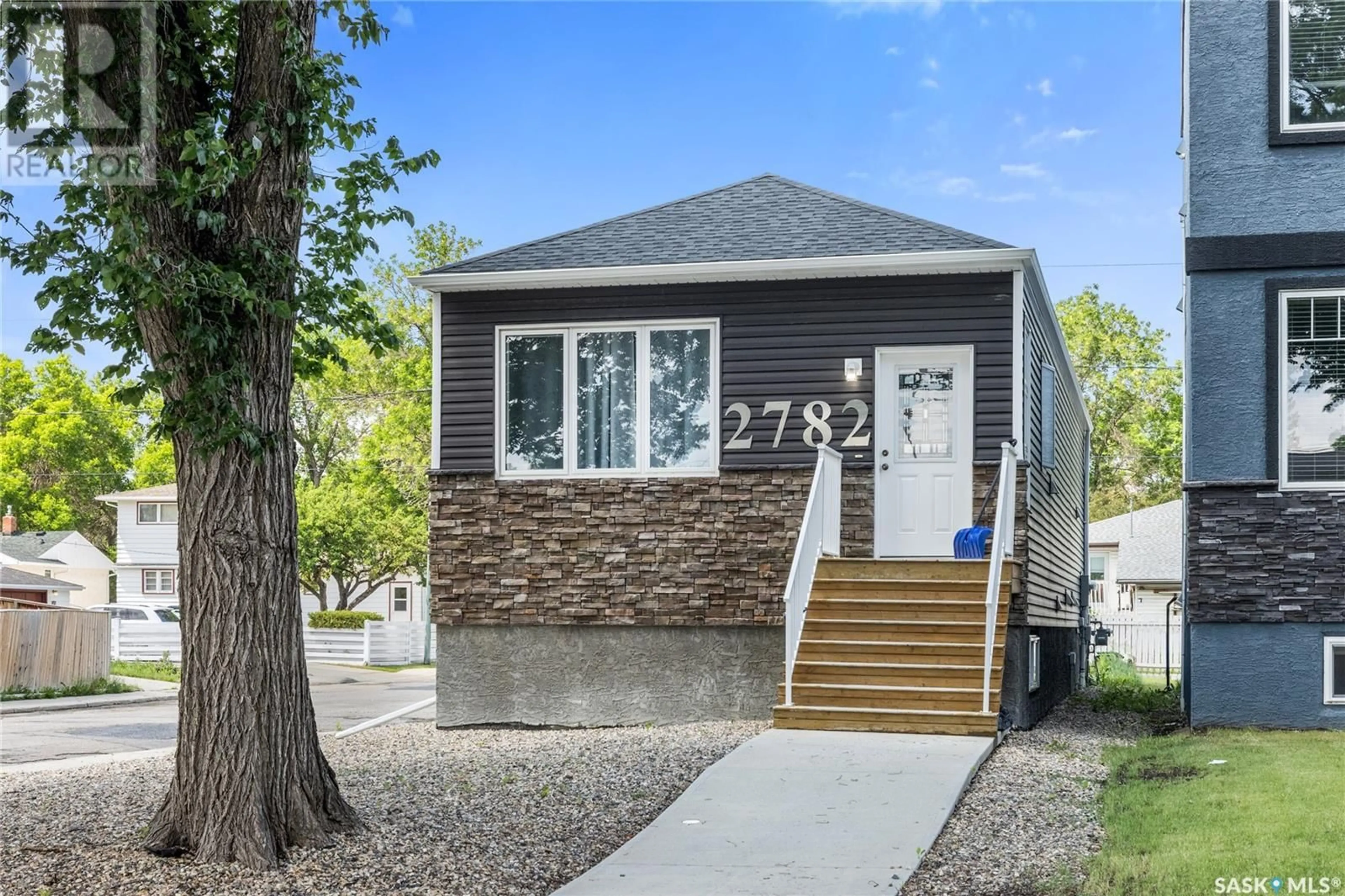 Home with vinyl exterior material, street for 2782 FRANCIS STREET, Regina Saskatchewan S4N2R3