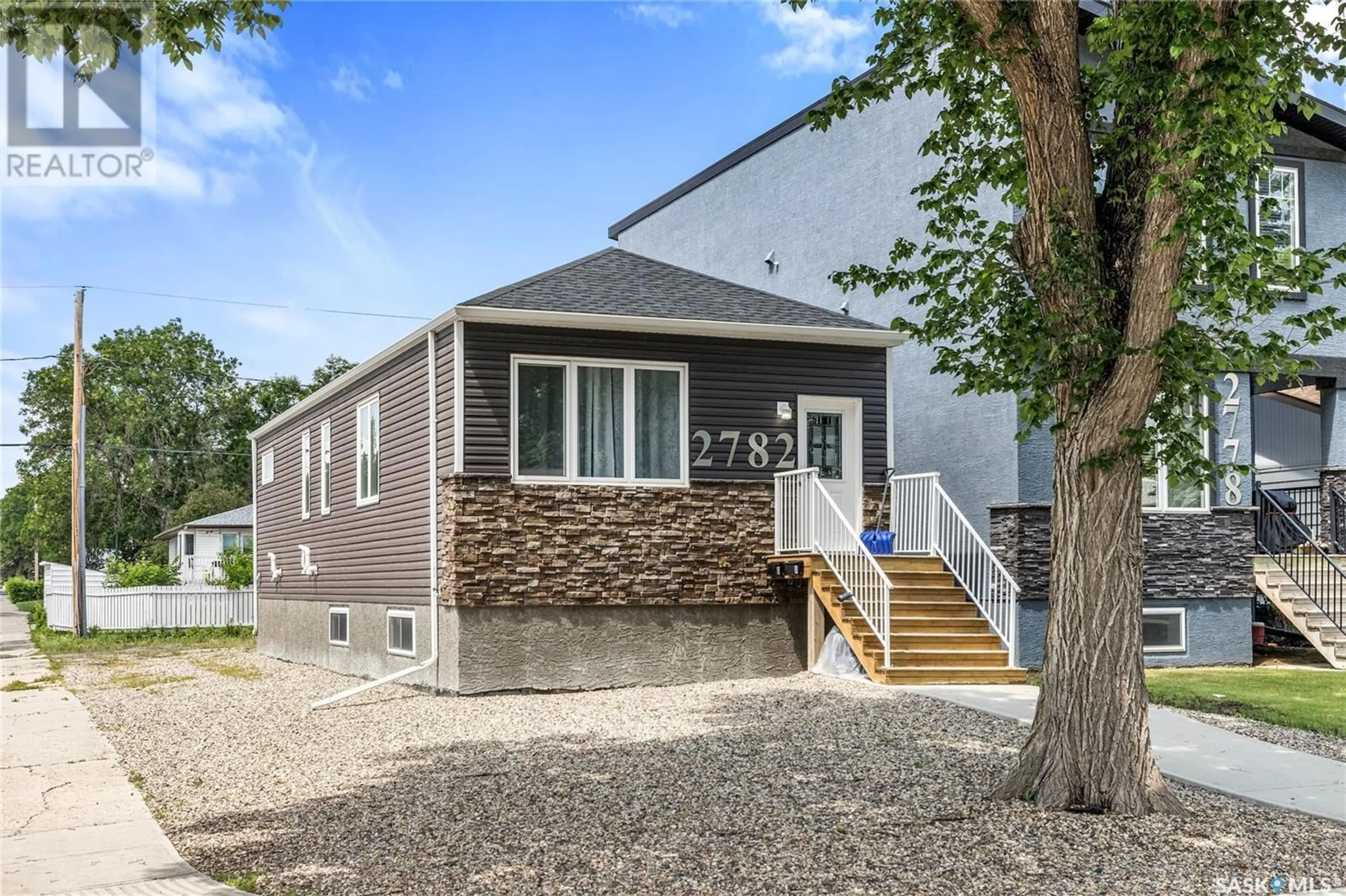 Home with vinyl exterior material, street for 2782 FRANCIS STREET, Regina Saskatchewan S4N2R3