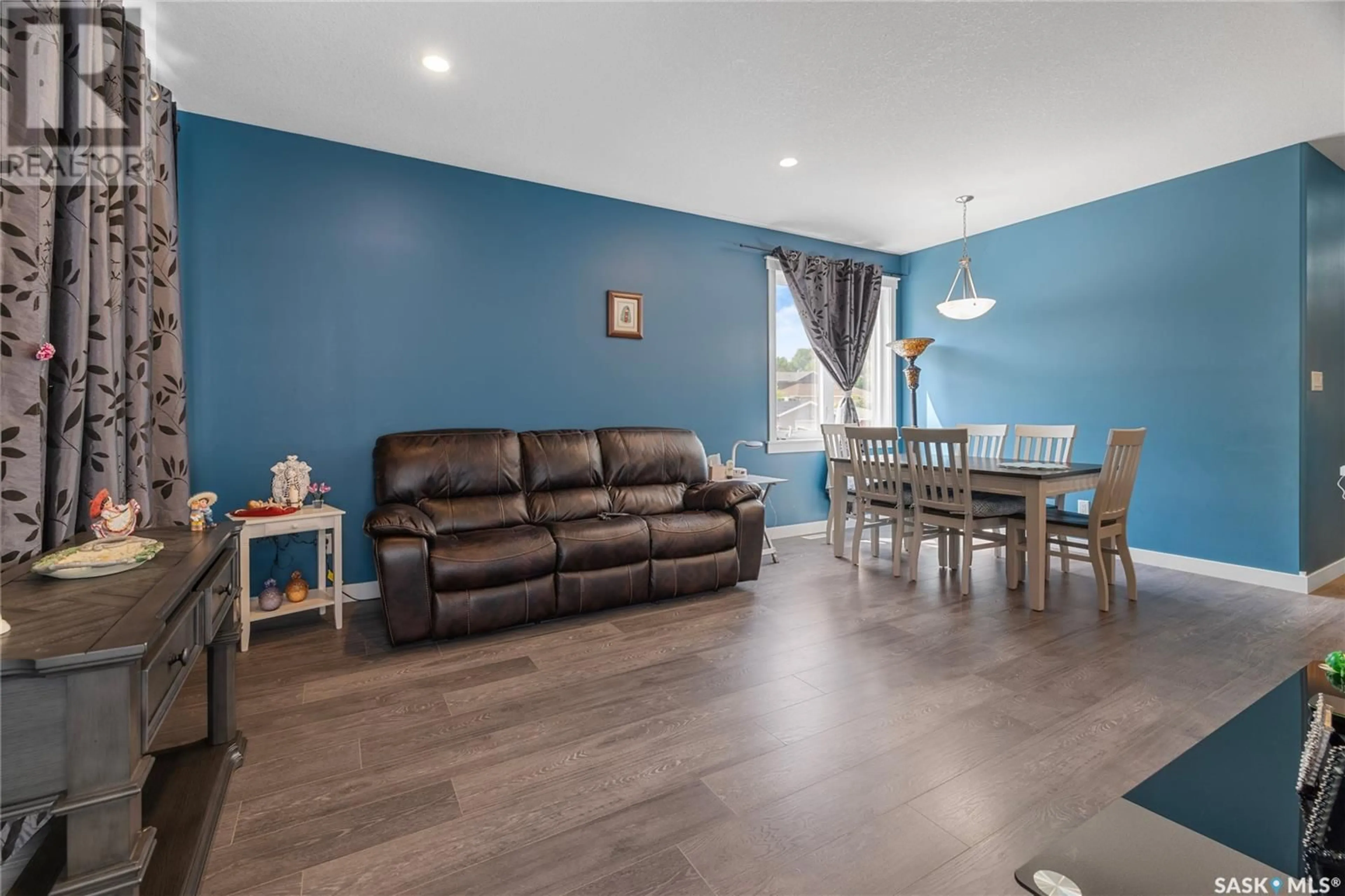 Living room with furniture, wood/laminate floor for 2782 FRANCIS STREET, Regina Saskatchewan S4N2R3