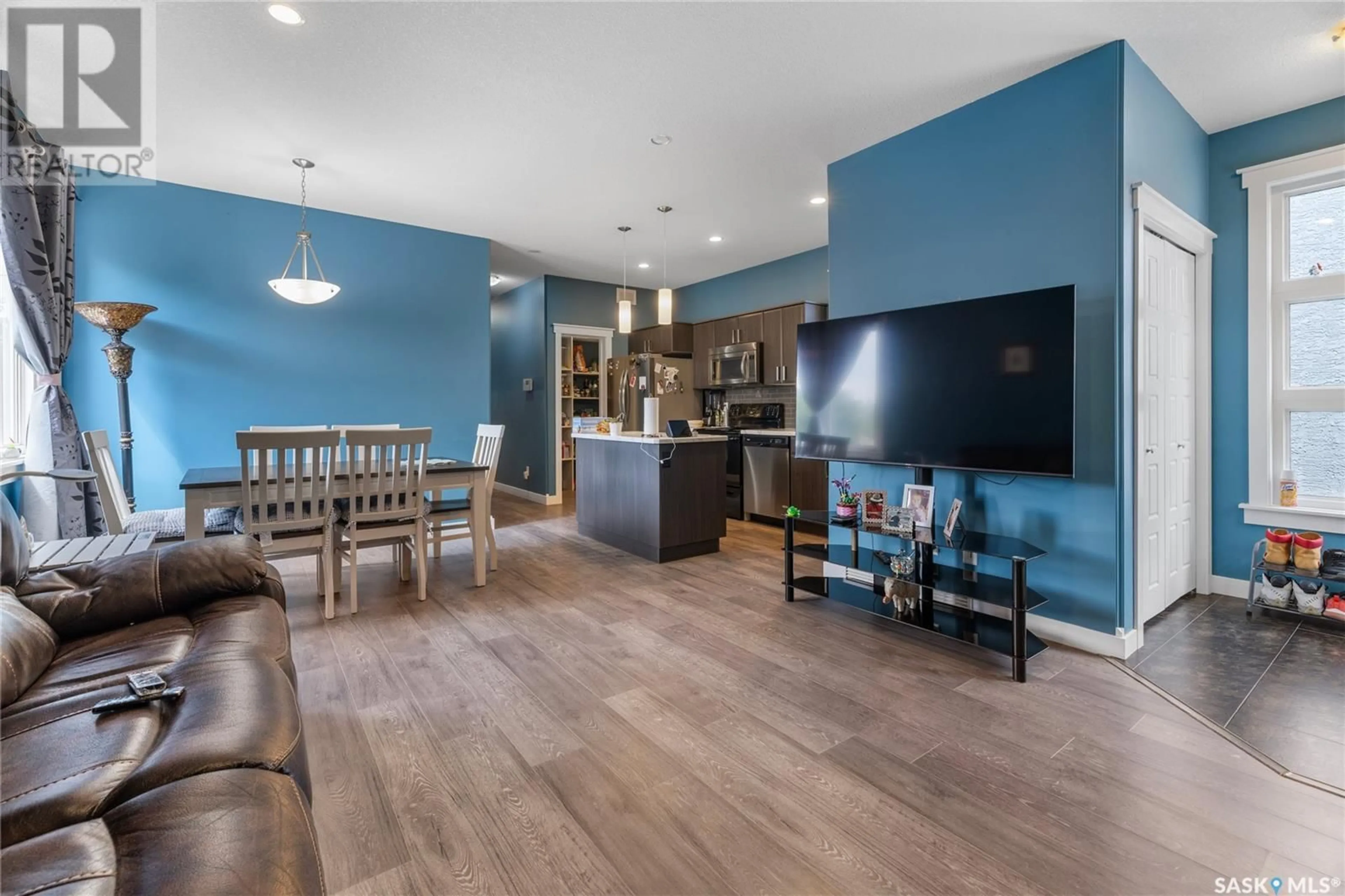 Open concept kitchen, wood/laminate floor for 2782 FRANCIS STREET, Regina Saskatchewan S4N2R3
