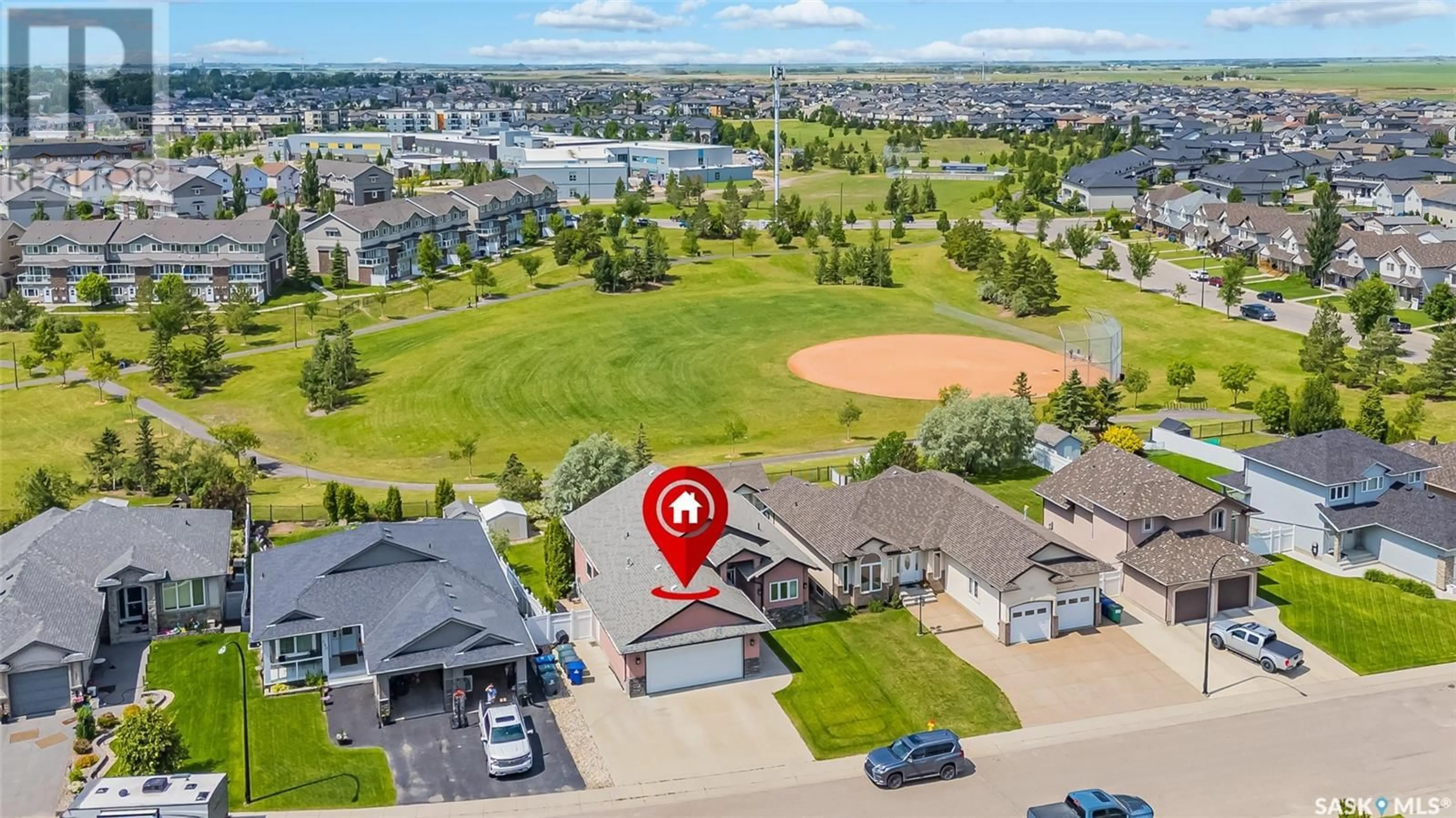 A pic from outside/outdoor area/front of a property/back of a property/a pic from drone, water/lake/river/ocean view for 122 ALLWOOD CRESCENT, Saskatoon Saskatchewan S7R0A3