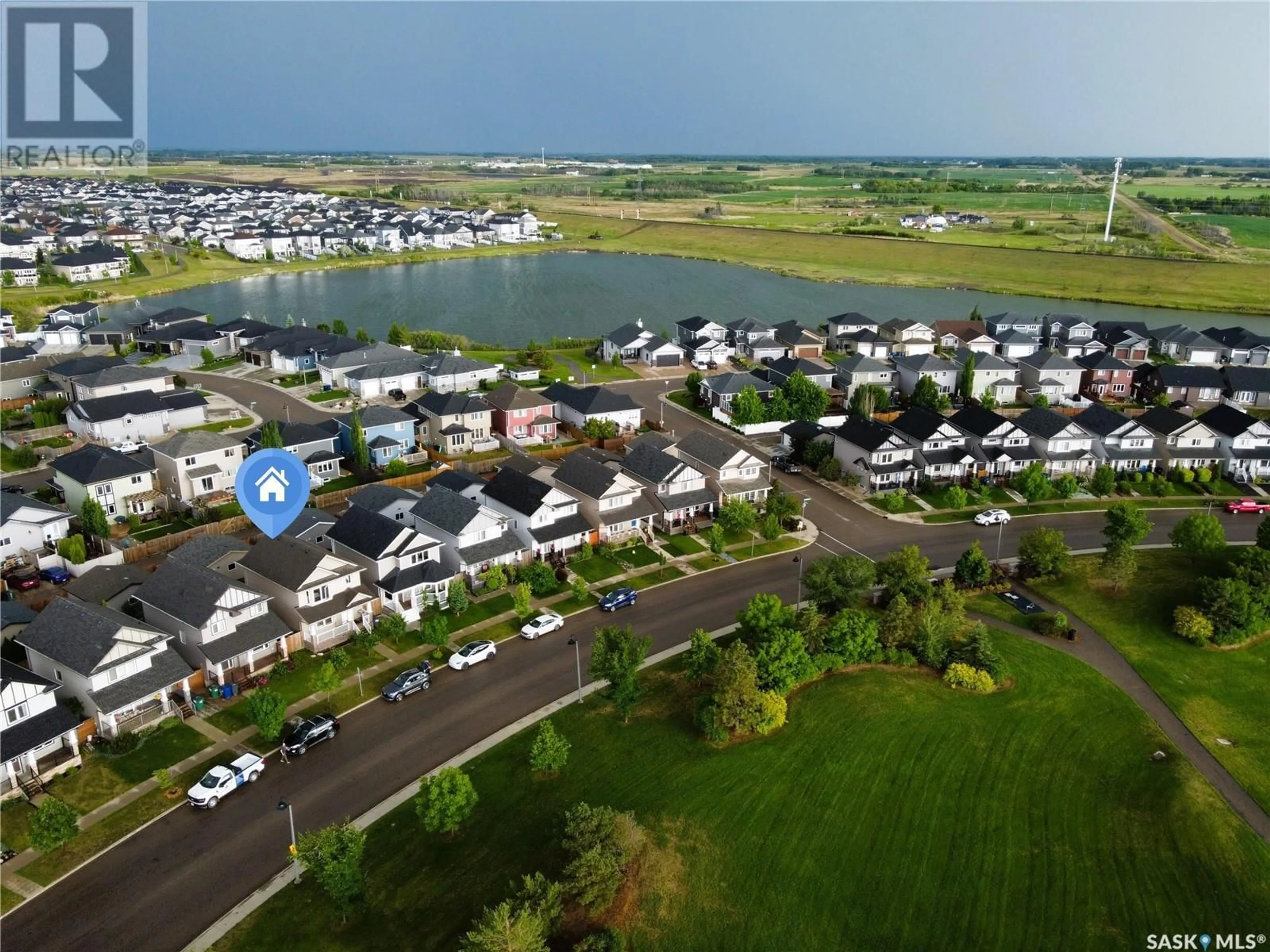 A pic from outside/outdoor area/front of a property/back of a property/a pic from drone, water/lake/river/ocean view for 726 STONEBRIDGE COMMON, Saskatoon Saskatchewan S7T0M8