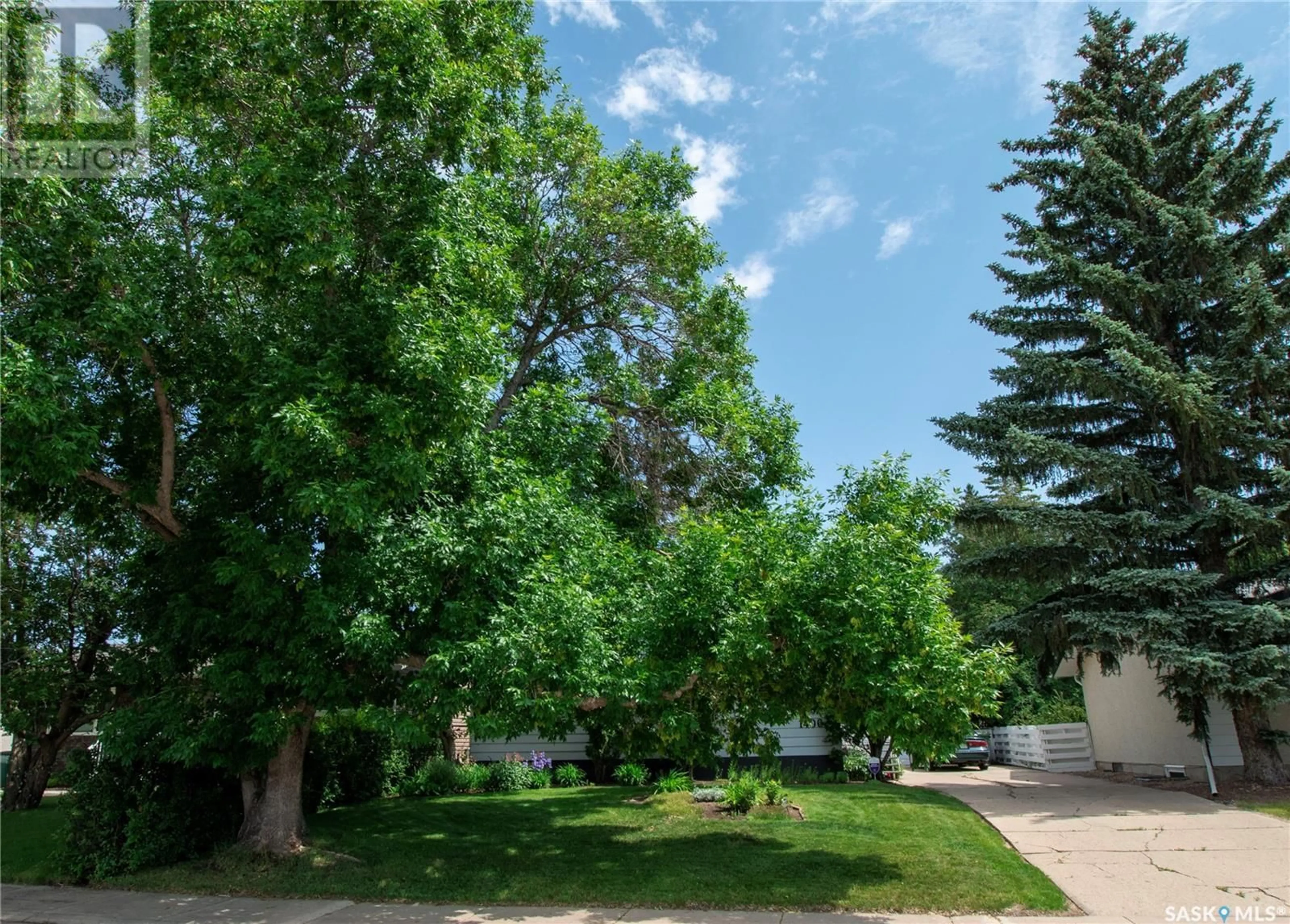 A pic from outside/outdoor area/front of a property/back of a property/a pic from drone, street for 1406 MCNAUGHTON AVENUE, Saskatoon Saskatchewan S7M3X8