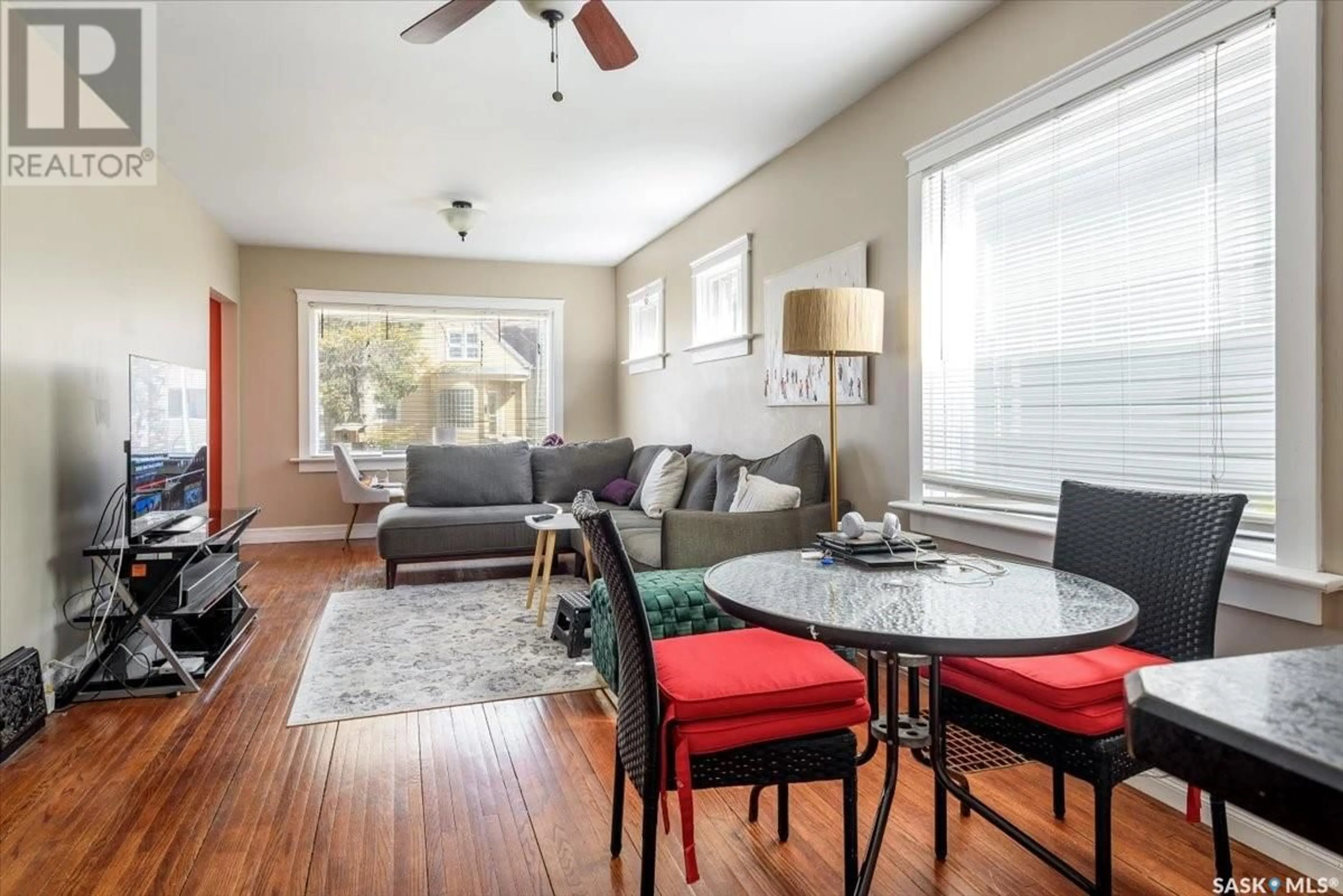 Living room with furniture, wood/laminate floor for 2074 QUEBEC STREET, Regina Saskatchewan S4P1J9