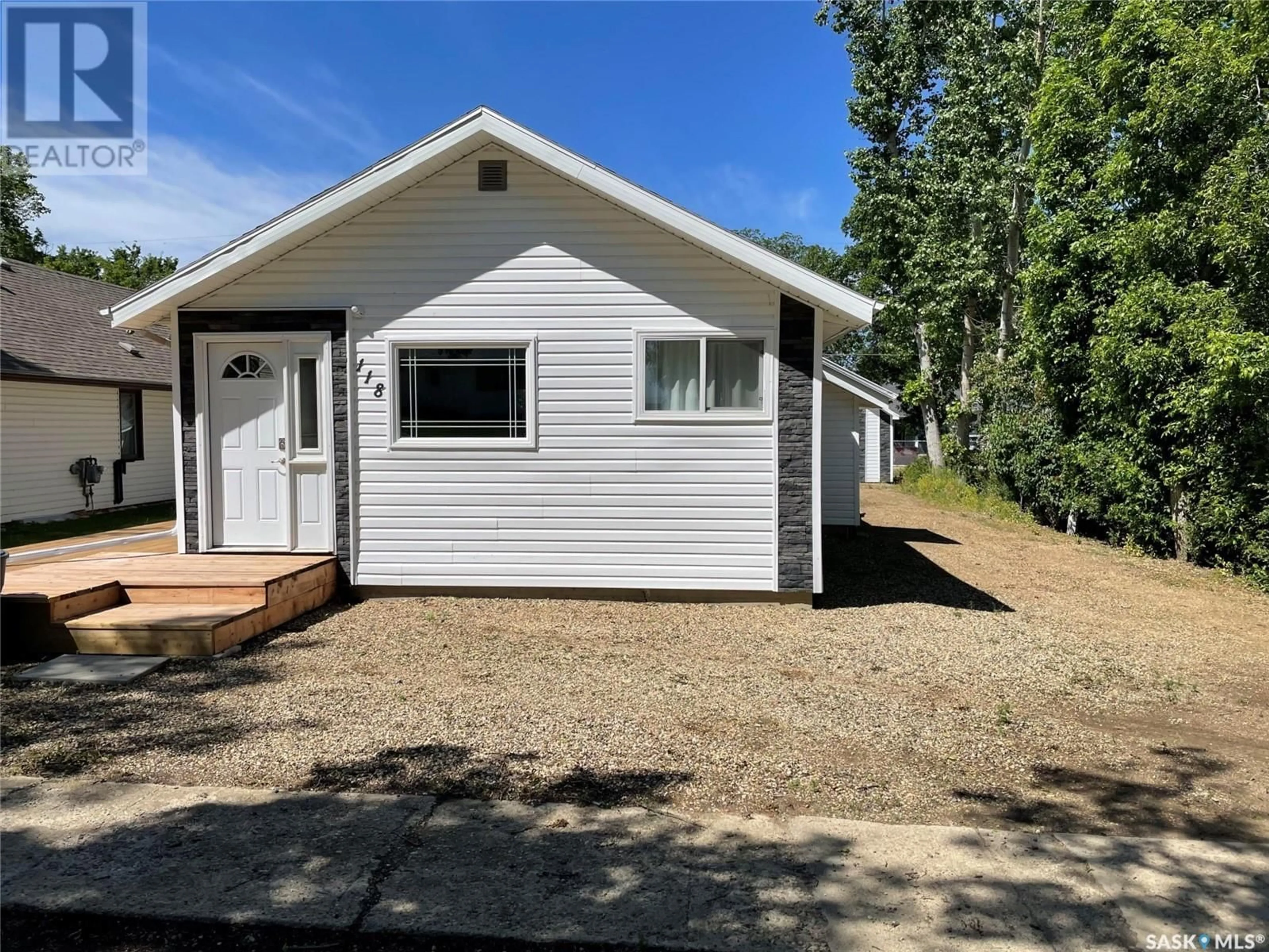 Home with vinyl exterior material, street for 118 2ND STREET, Lafleche Saskatchewan S0H2K0