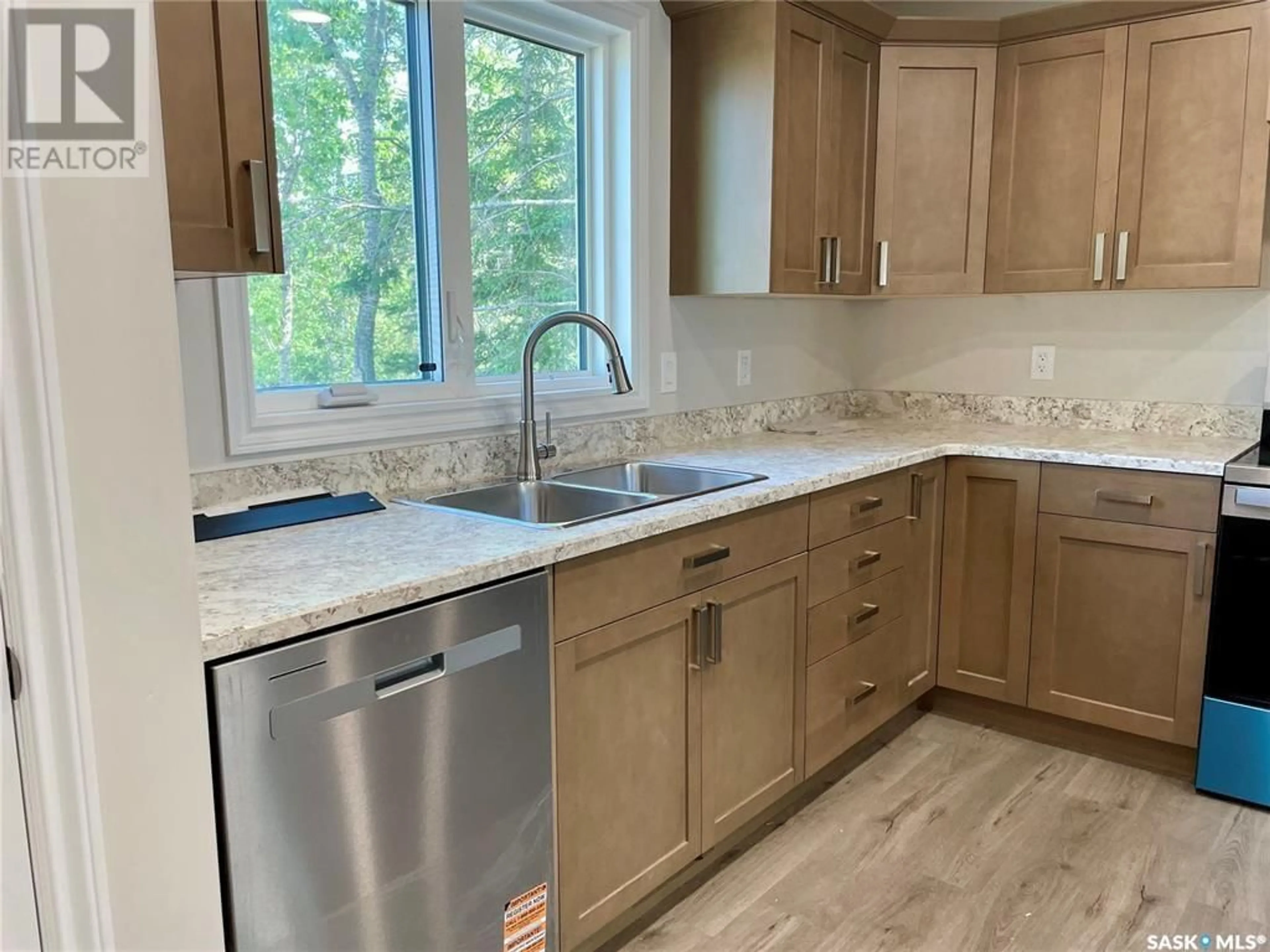 Open concept kitchen, ceramic/tile floor for 1121 DEERFOOT TRAIL, Good Spirit Lake Saskatchewan S0A0L0