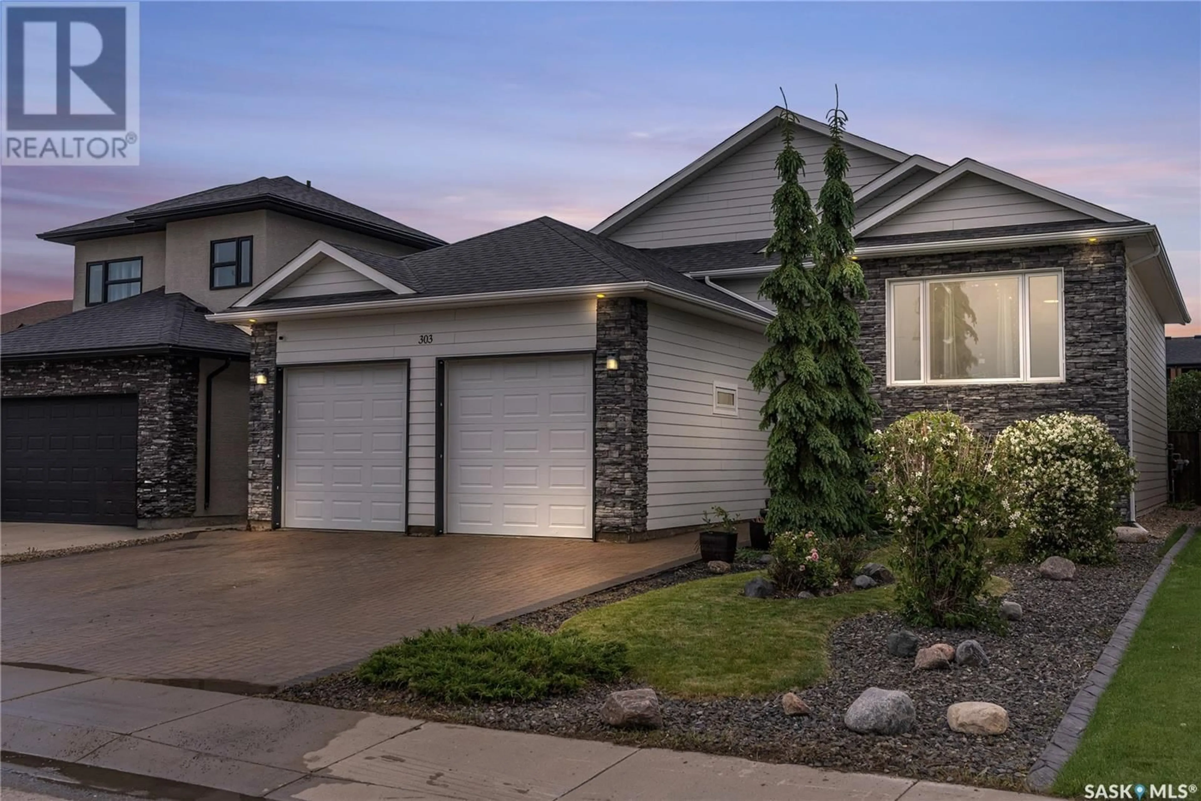 Home with vinyl exterior material, street for 303 ATTON CRESCENT, Saskatoon Saskatchewan S7W0K8