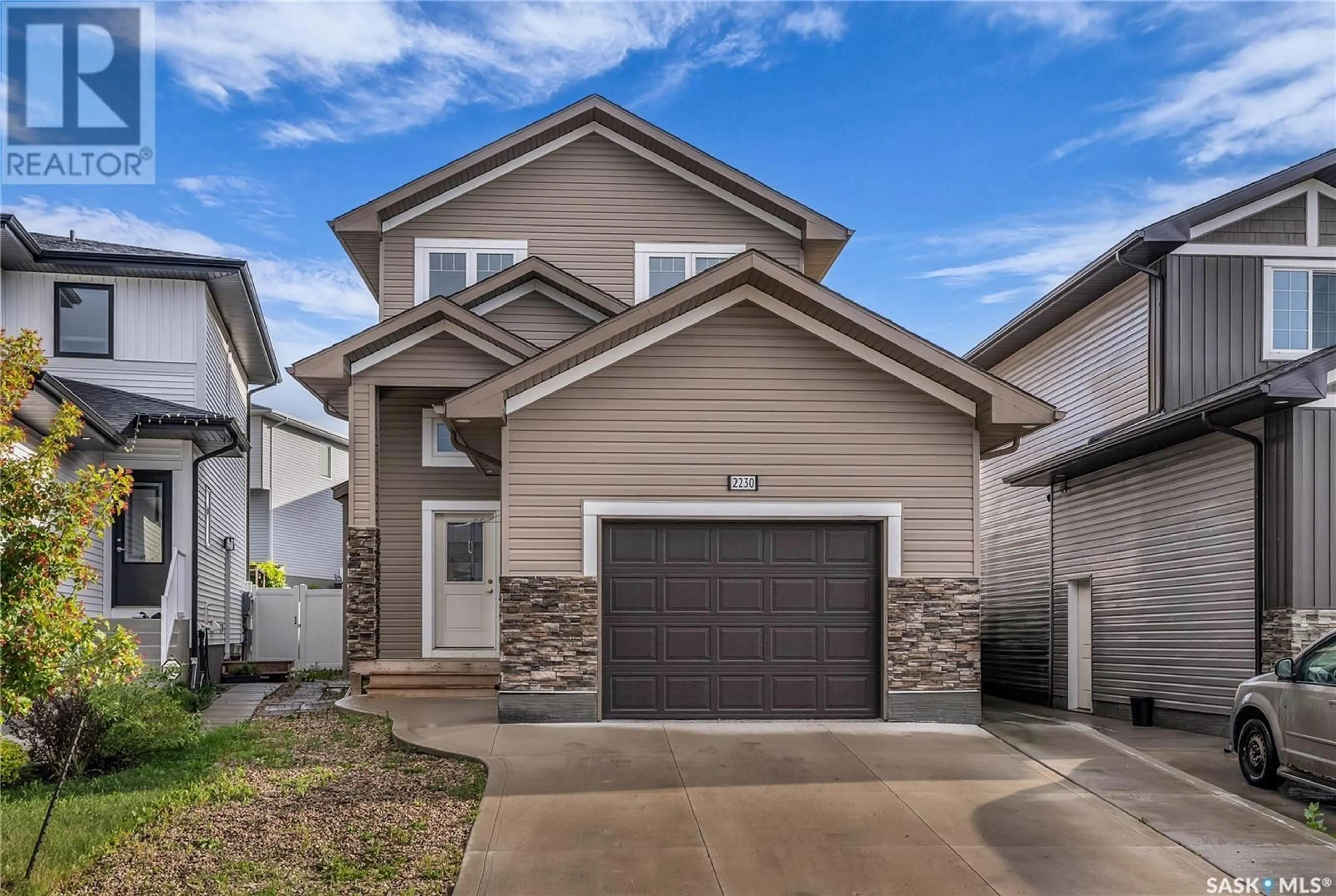Home with vinyl exterior material, street for 2230 ROSEWOOD DRIVE, Saskatoon Saskatchewan S7V0S2