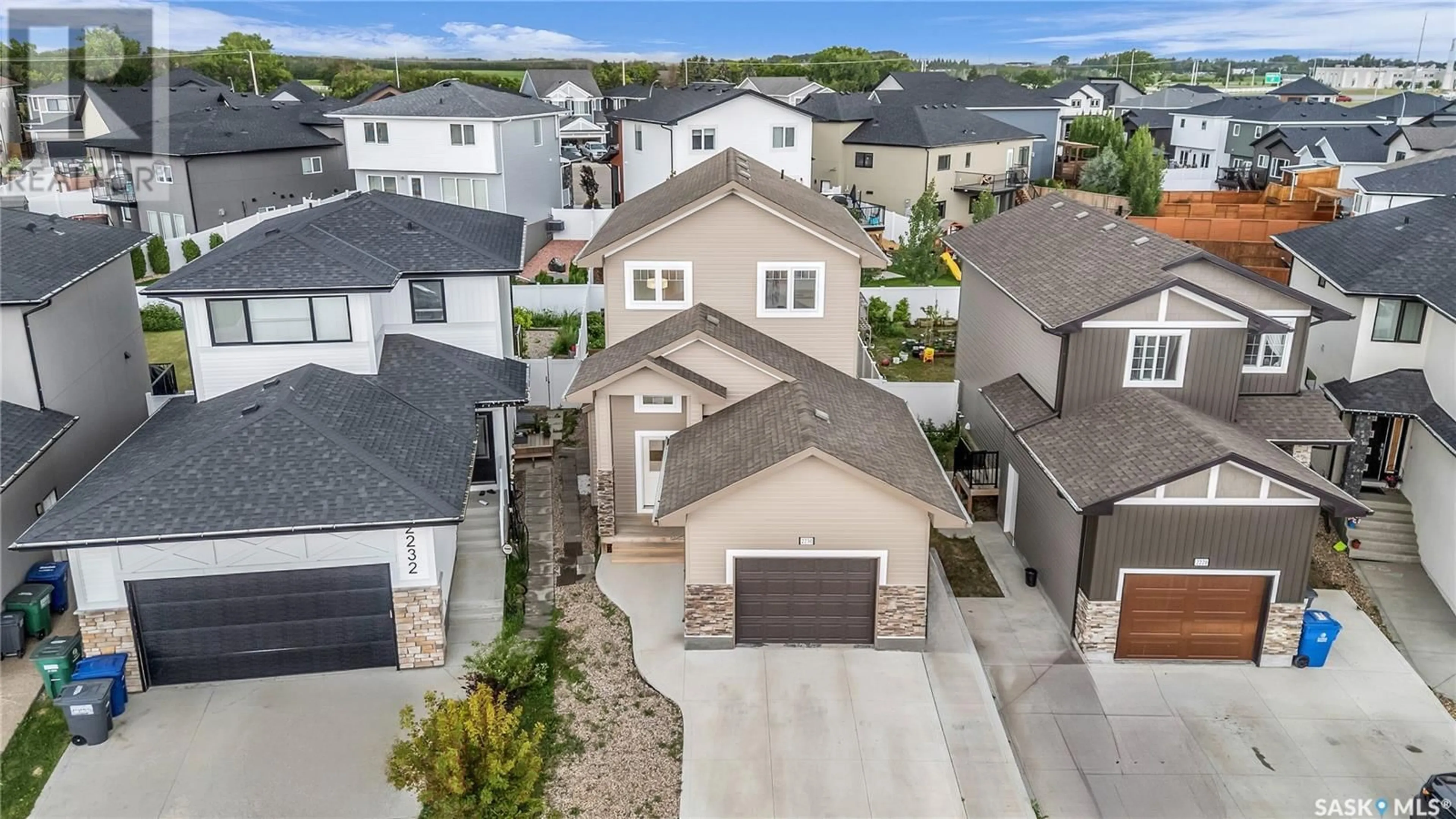 A pic from outside/outdoor area/front of a property/back of a property/a pic from drone, street for 2230 ROSEWOOD DRIVE, Saskatoon Saskatchewan S7V0S2