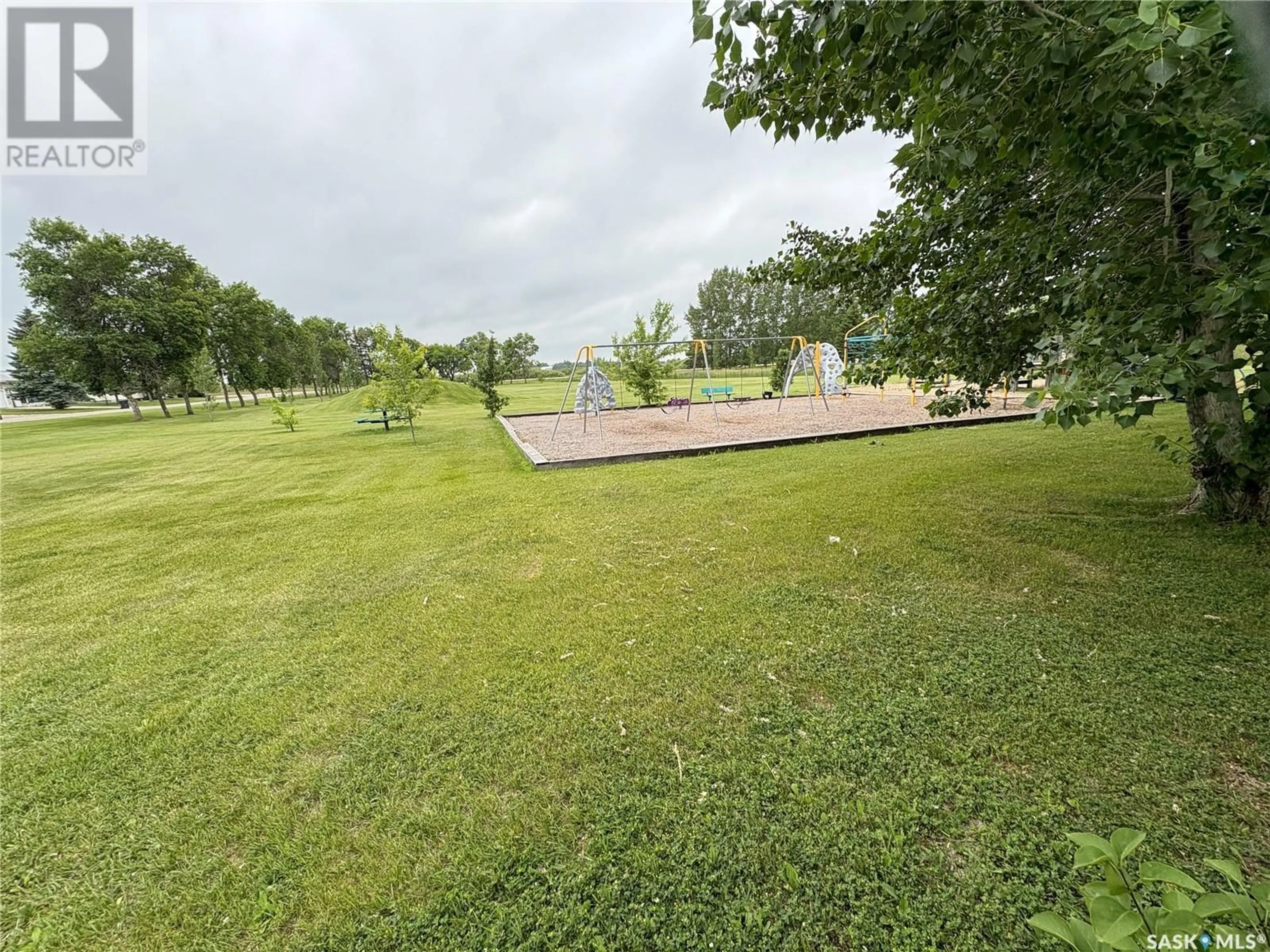 A pic from outside/outdoor area/front of a property/back of a property/a pic from drone, water/lake/river/ocean view for 204 HILLSIDE BAY, Langenburg Saskatchewan S0A2A0