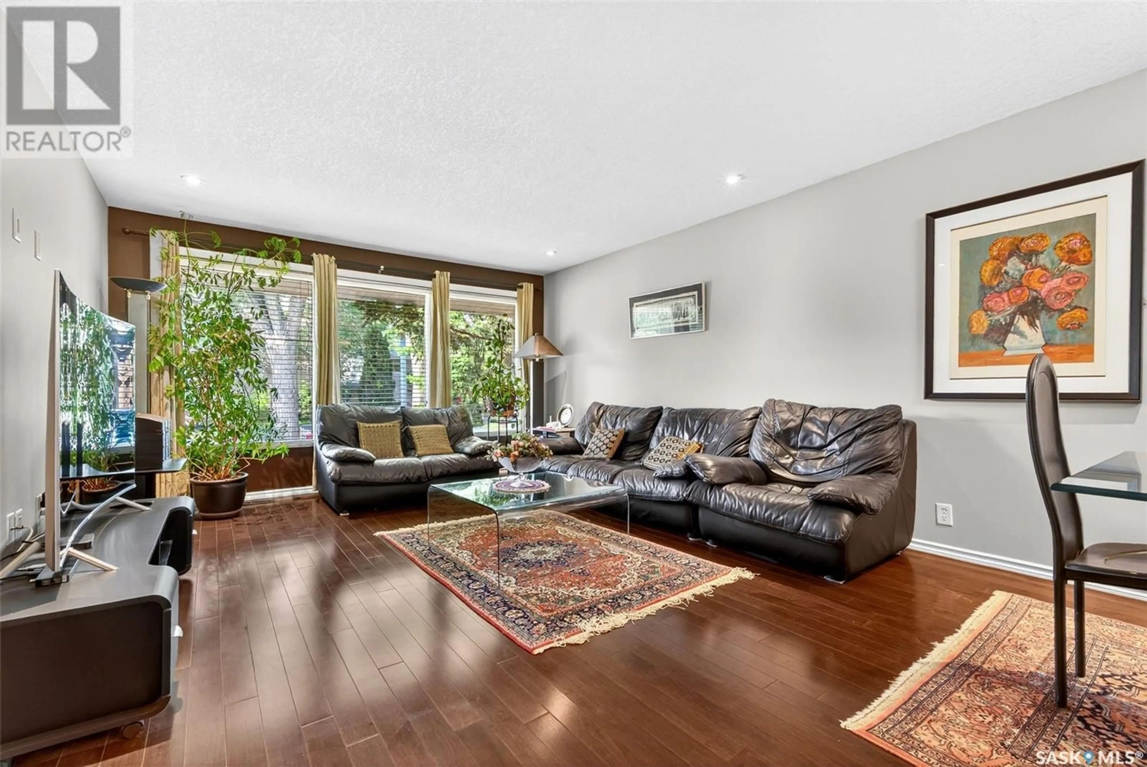 Living room with furniture, wood/laminate floor for 45 GARDINER AVENUE, Regina Saskatchewan S4S4P5