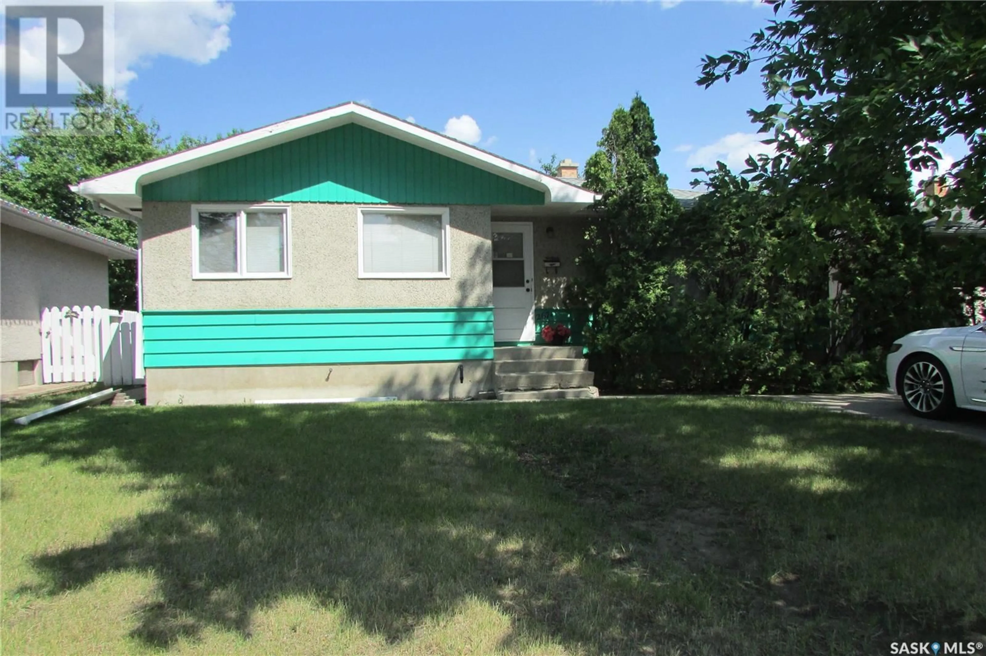 Home with vinyl exterior material, street for 267 SMITH STREET, Regina Saskatchewan S4R3B5