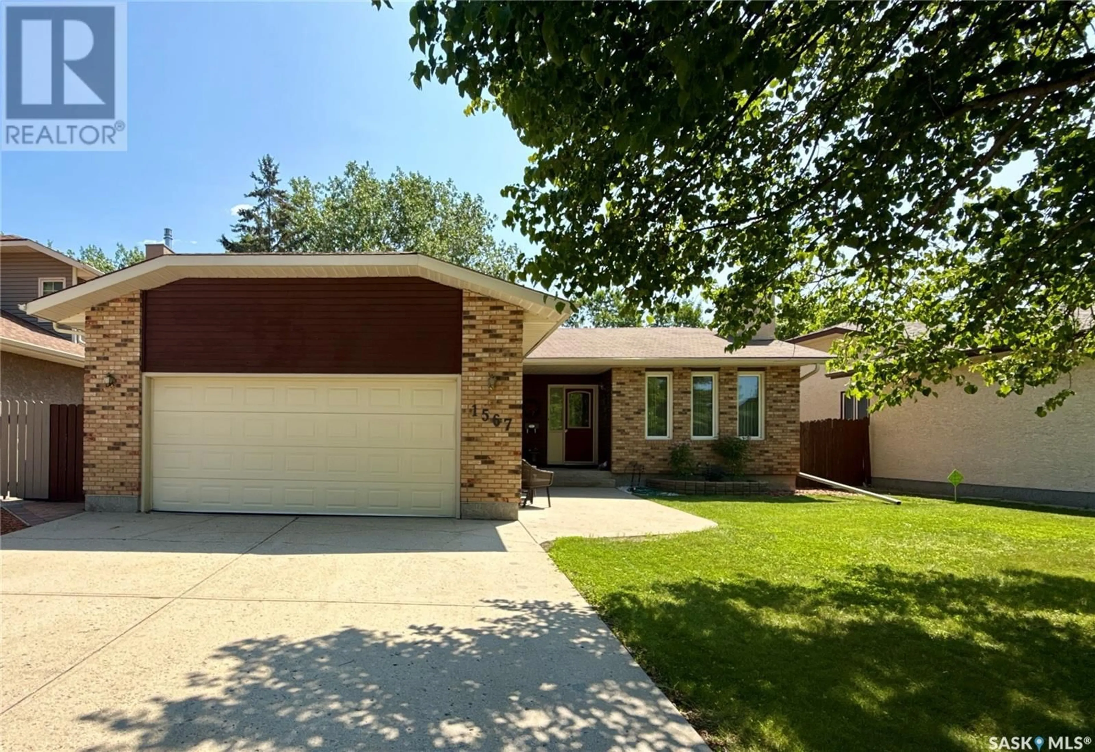 Home with brick exterior material, street for 1567 LEE-GRAYSON CRESCENT, Regina Saskatchewan S4X3Z8