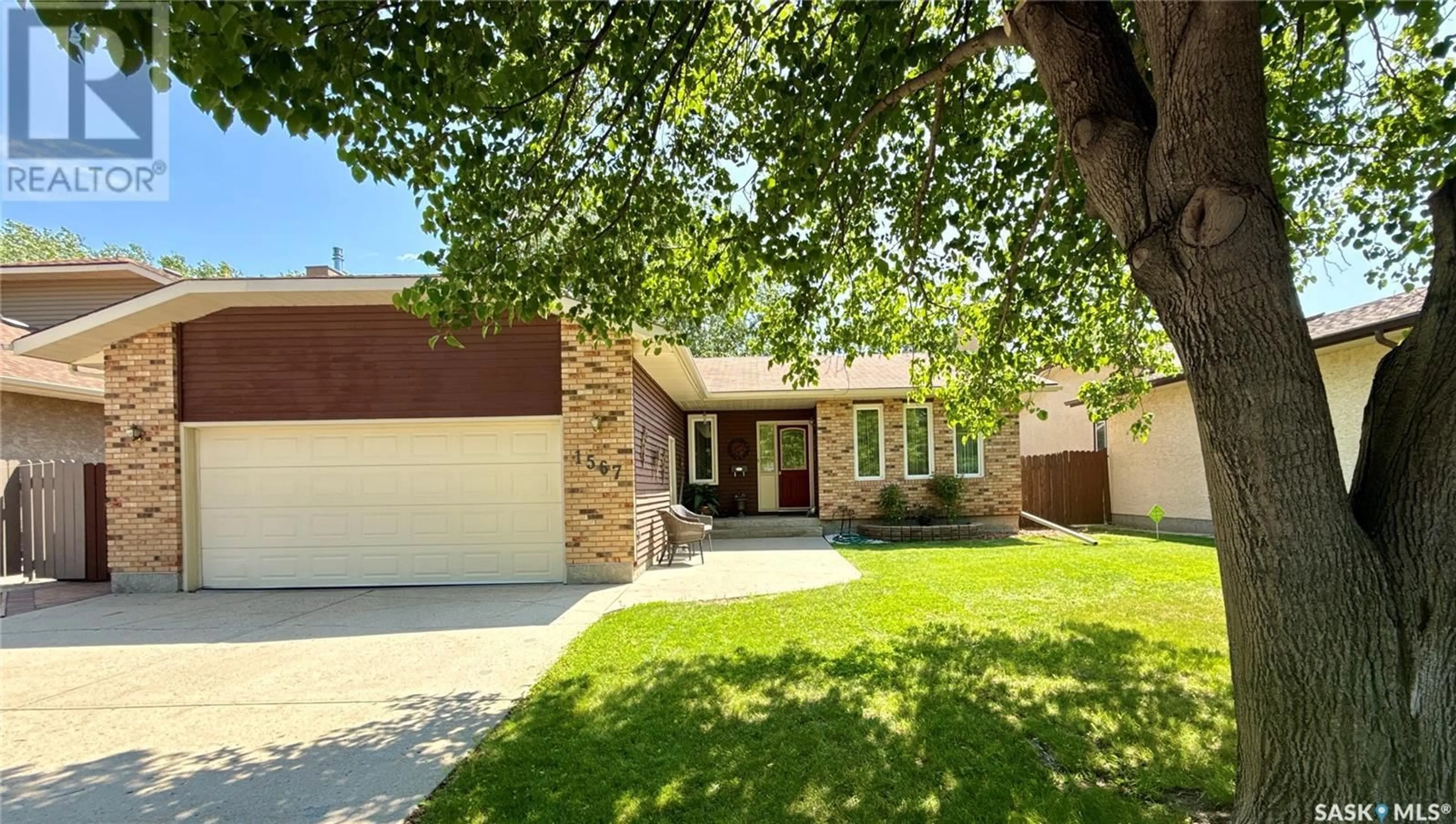 Home with brick exterior material, street for 1567 LEE-GRAYSON CRESCENT, Regina Saskatchewan S4X3Z8