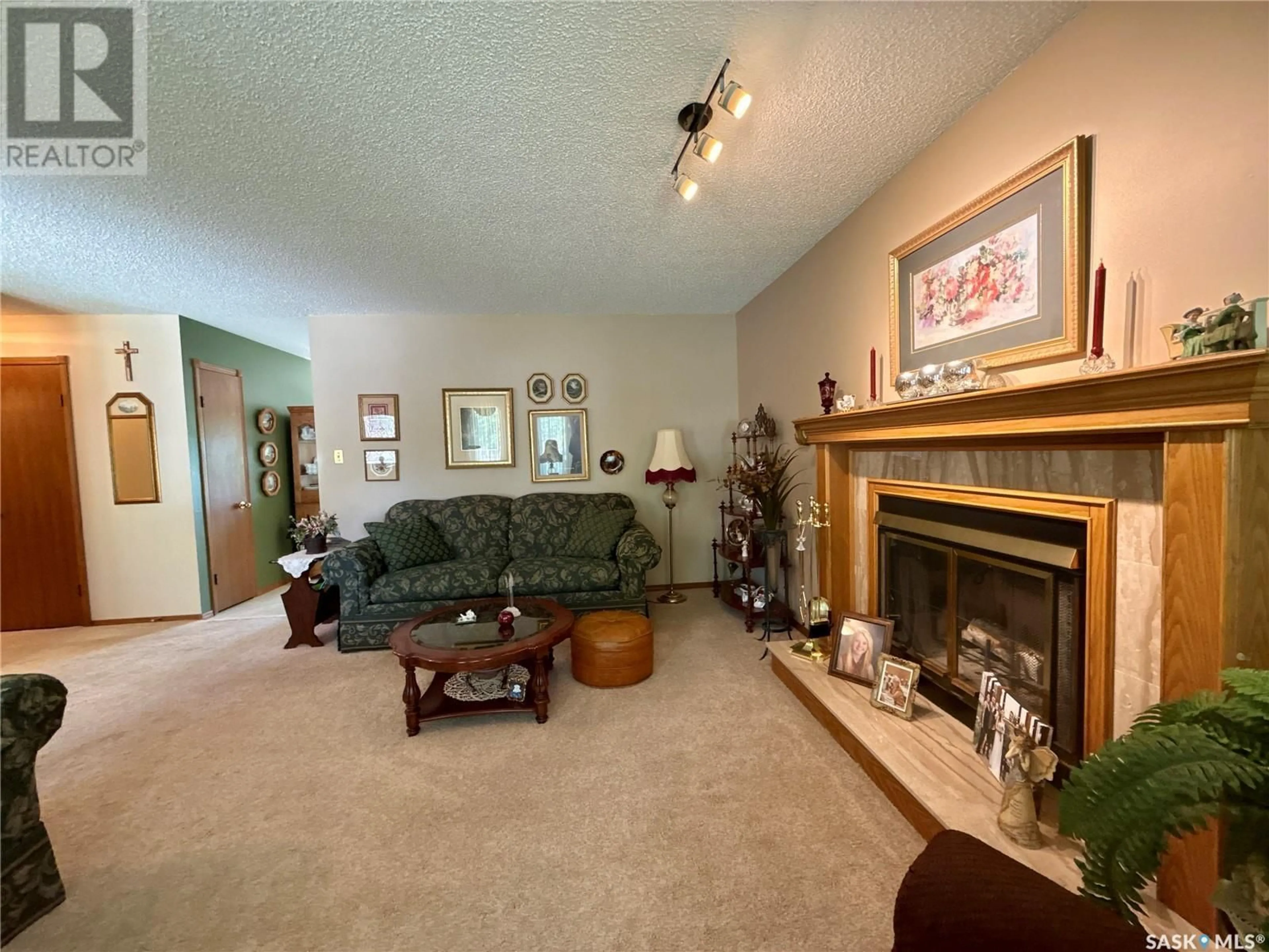 Living room with furniture, unknown for 1567 LEE-GRAYSON CRESCENT, Regina Saskatchewan S4X3Z8