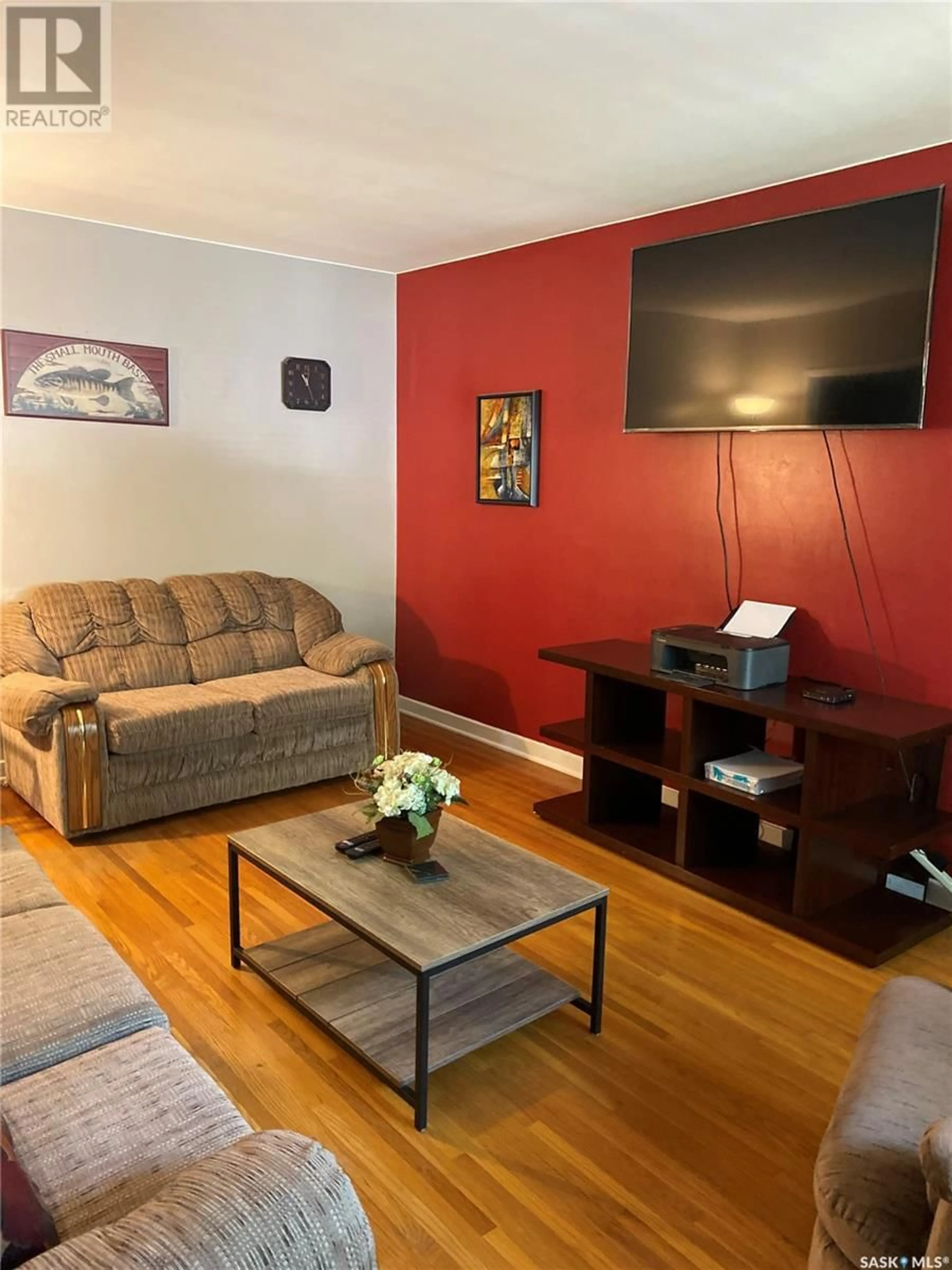 Living room with furniture, wood/laminate floor for 1351 GREY STREET, Regina Saskatchewan S4T5H5