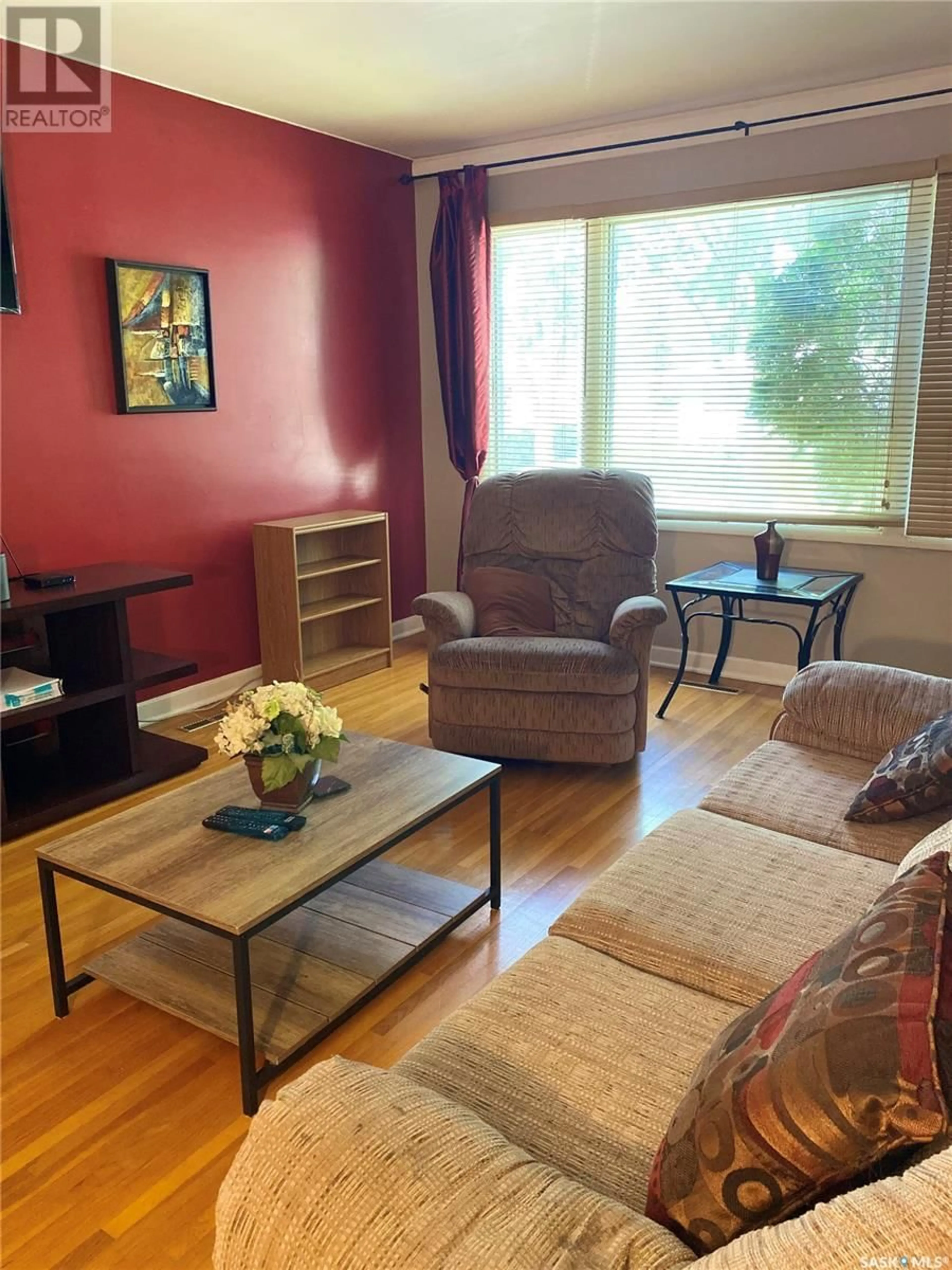 Living room with furniture, wood/laminate floor for 1351 GREY STREET, Regina Saskatchewan S4T5H5