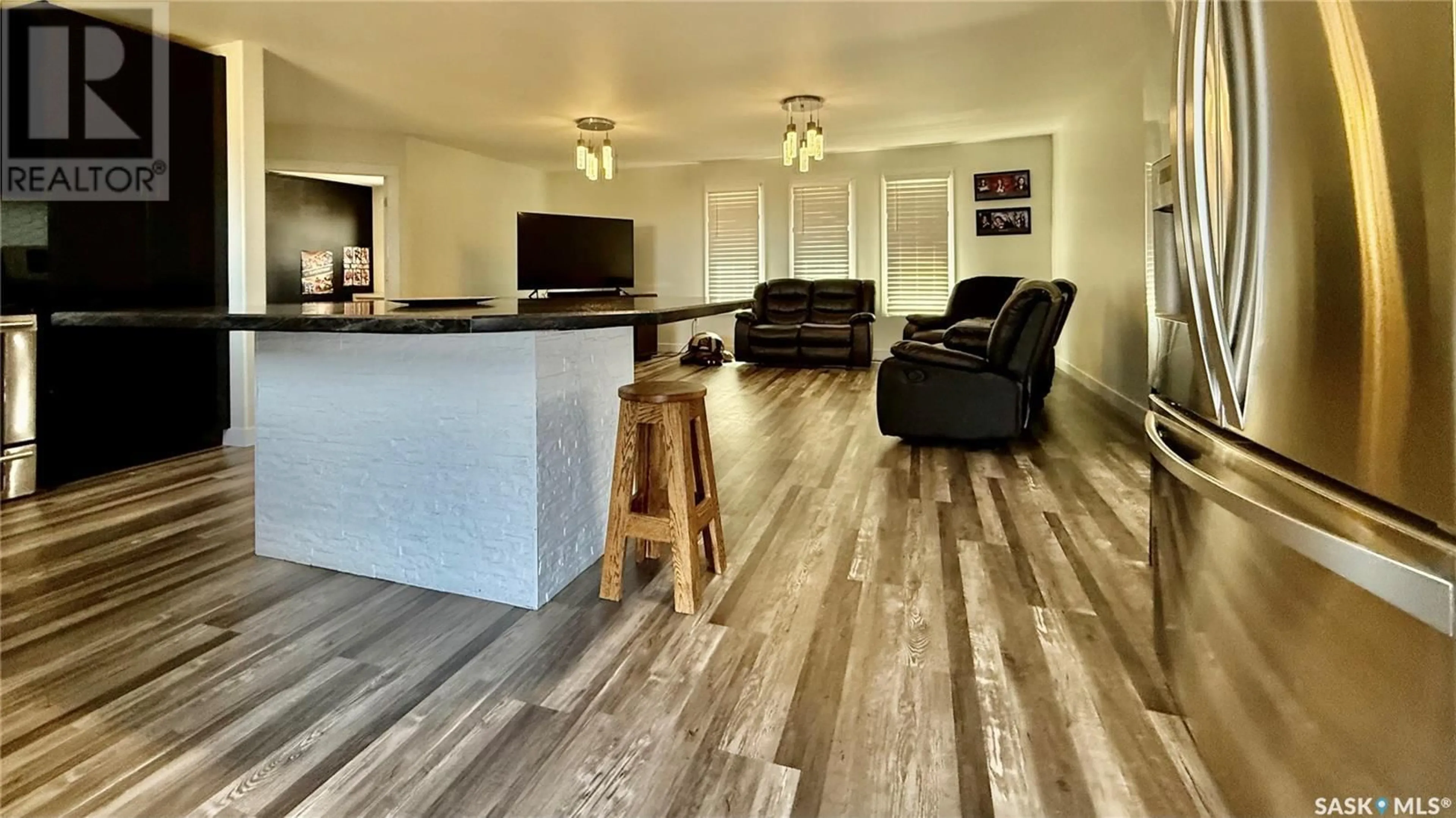 Living room with furniture, wood/laminate floor for EMERALD ACREAGE, Emerald Rm No. 277 Saskatchewan S0A1A0