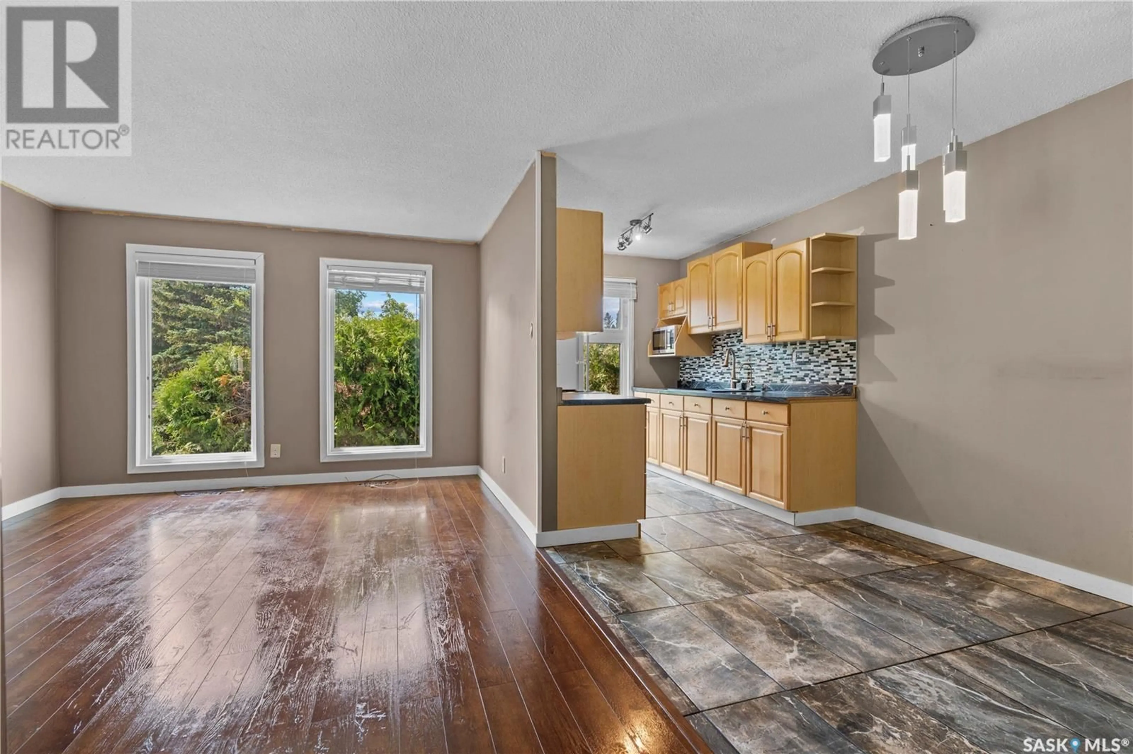 Open concept kitchen, ceramic/tile floor for 6606 HANCOCK BAY, Regina Saskatchewan S4X1V1