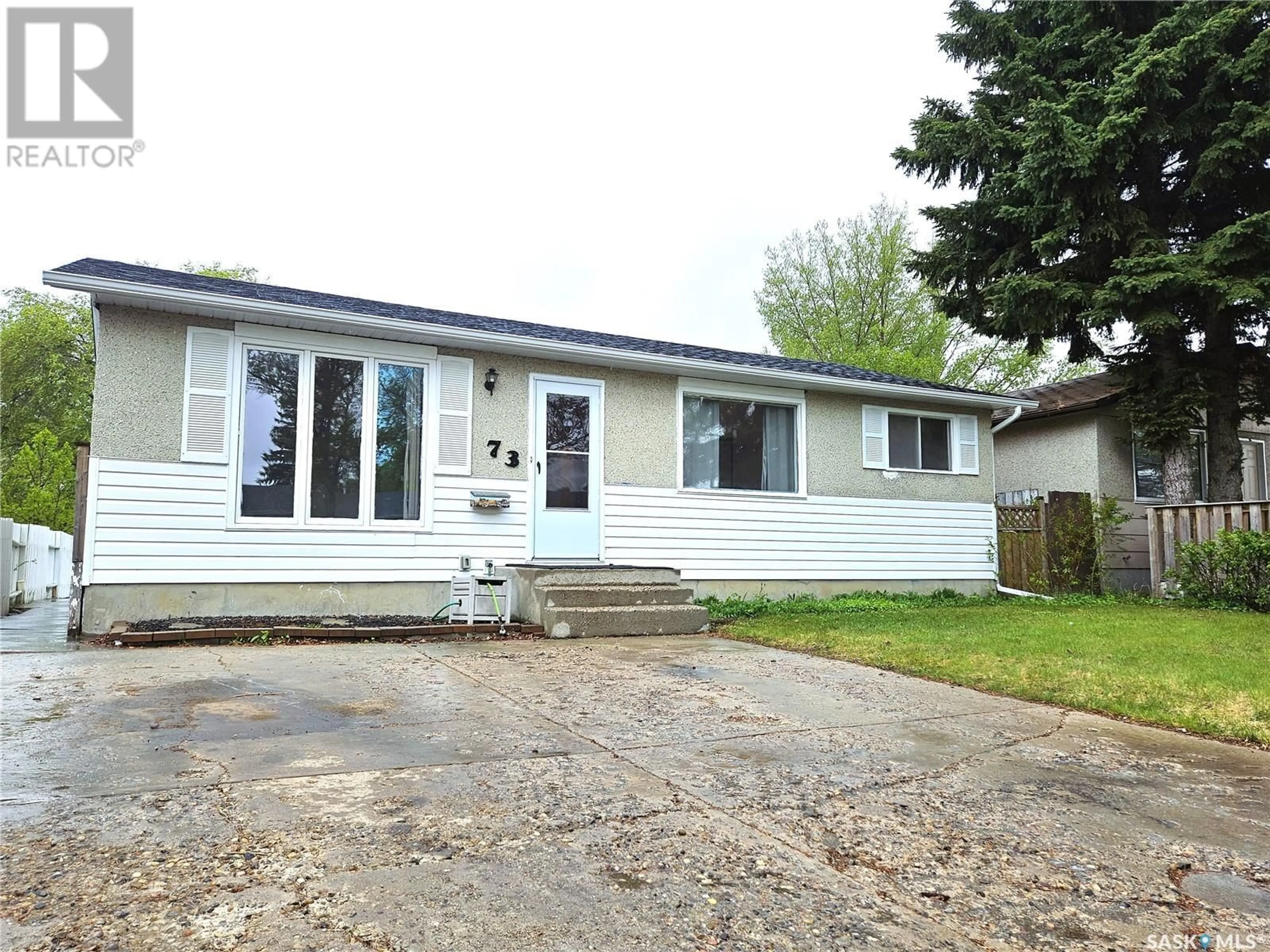 Home with vinyl exterior material, street for 73 CARTIER CRESCENT, Saskatoon Saskatchewan S7L4L8