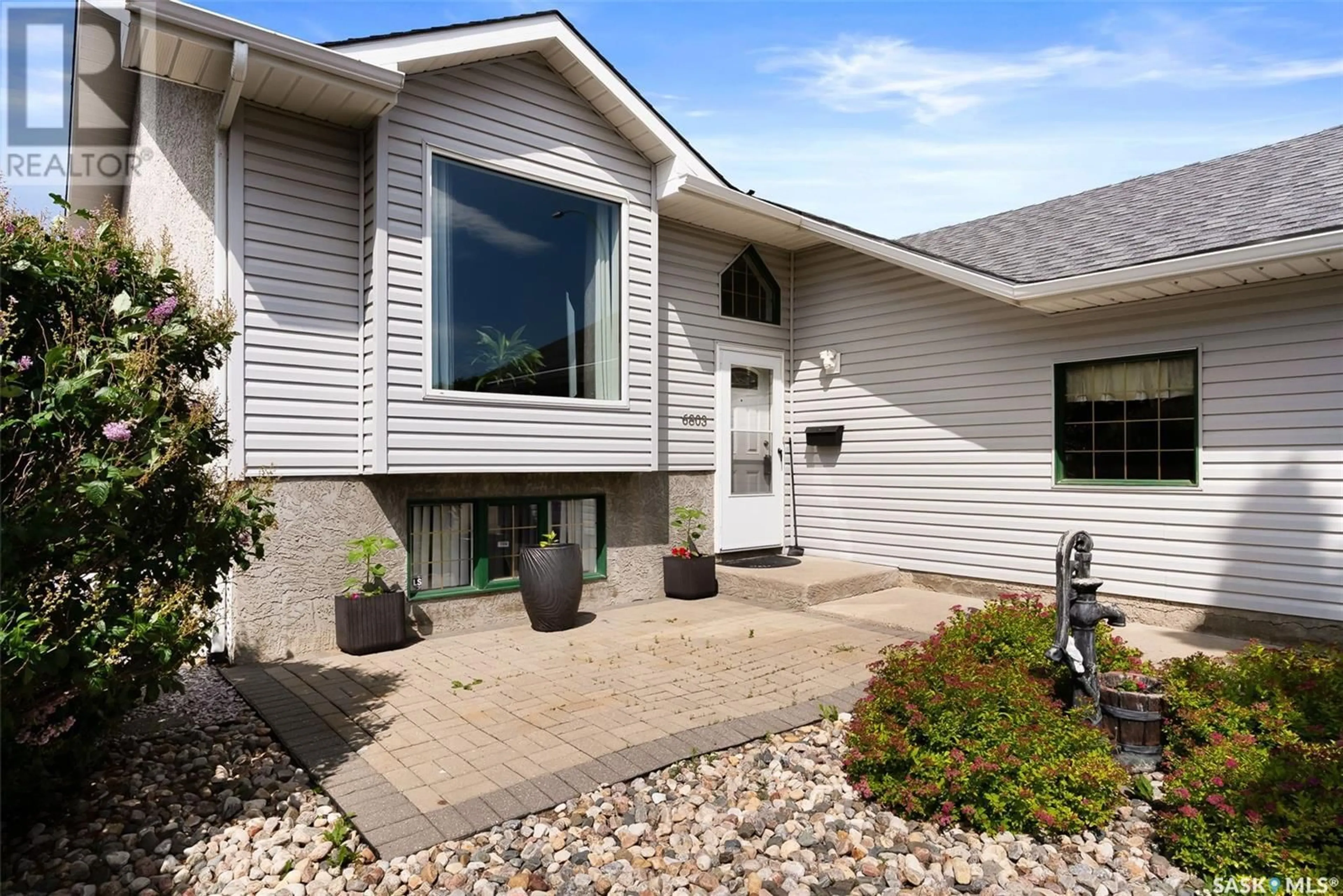 Home with vinyl exterior material, street for 6803 MAPLE WOOD CRESCENT, Regina Saskatchewan S4X4J8