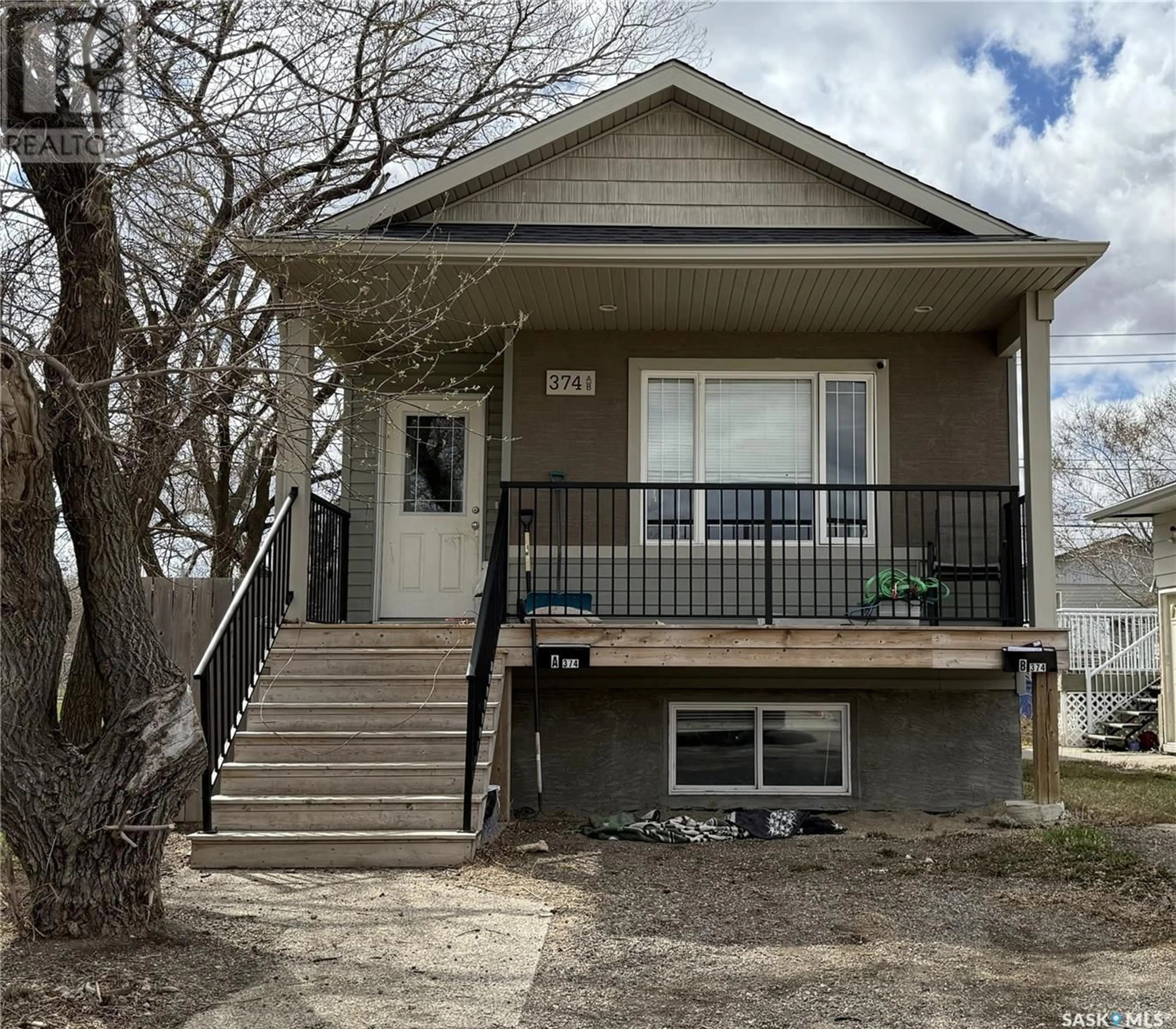 Home with vinyl exterior material, street for 374 WASCANA STREET, Regina Saskatchewan S4R4H9