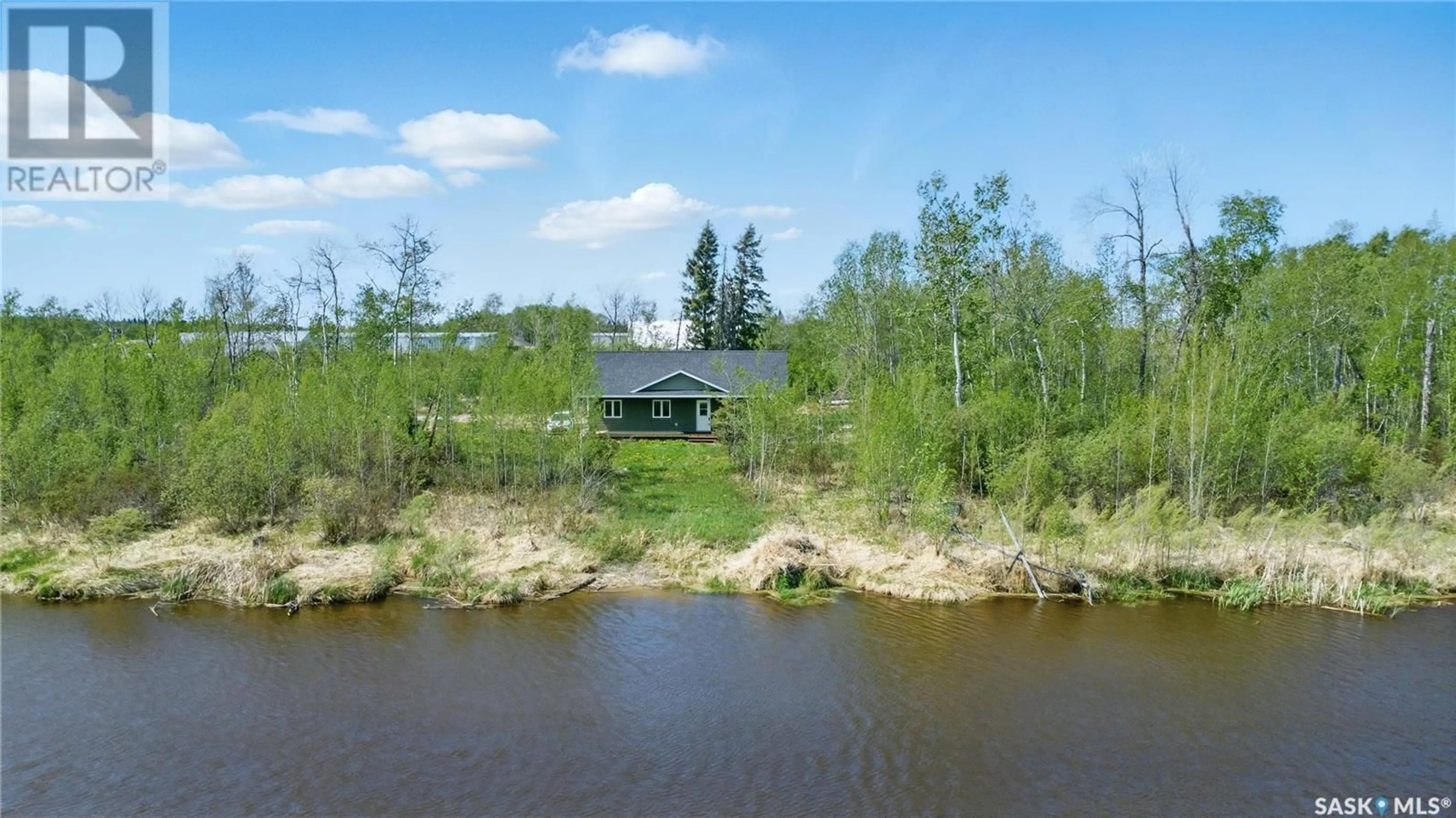 A pic from outside/outdoor area/front of a property/back of a property/a pic from drone, water/lake/river/ocean view for 304 RAILWAY AVENUE, Meath Park Saskatchewan S0J1T0