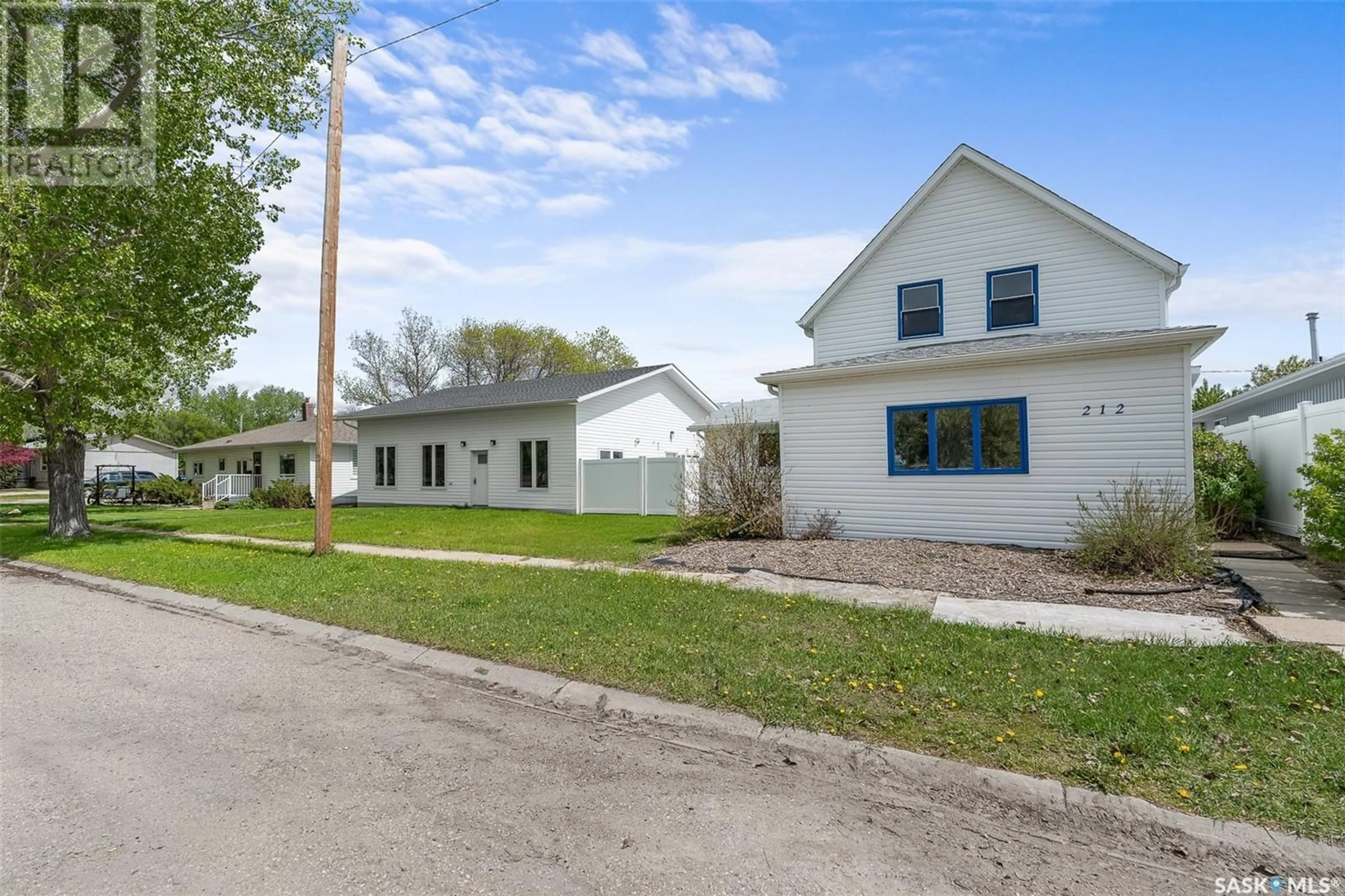 Home with vinyl exterior material, street for 212 MAIN STREET, Rouleau Saskatchewan S0G4H0