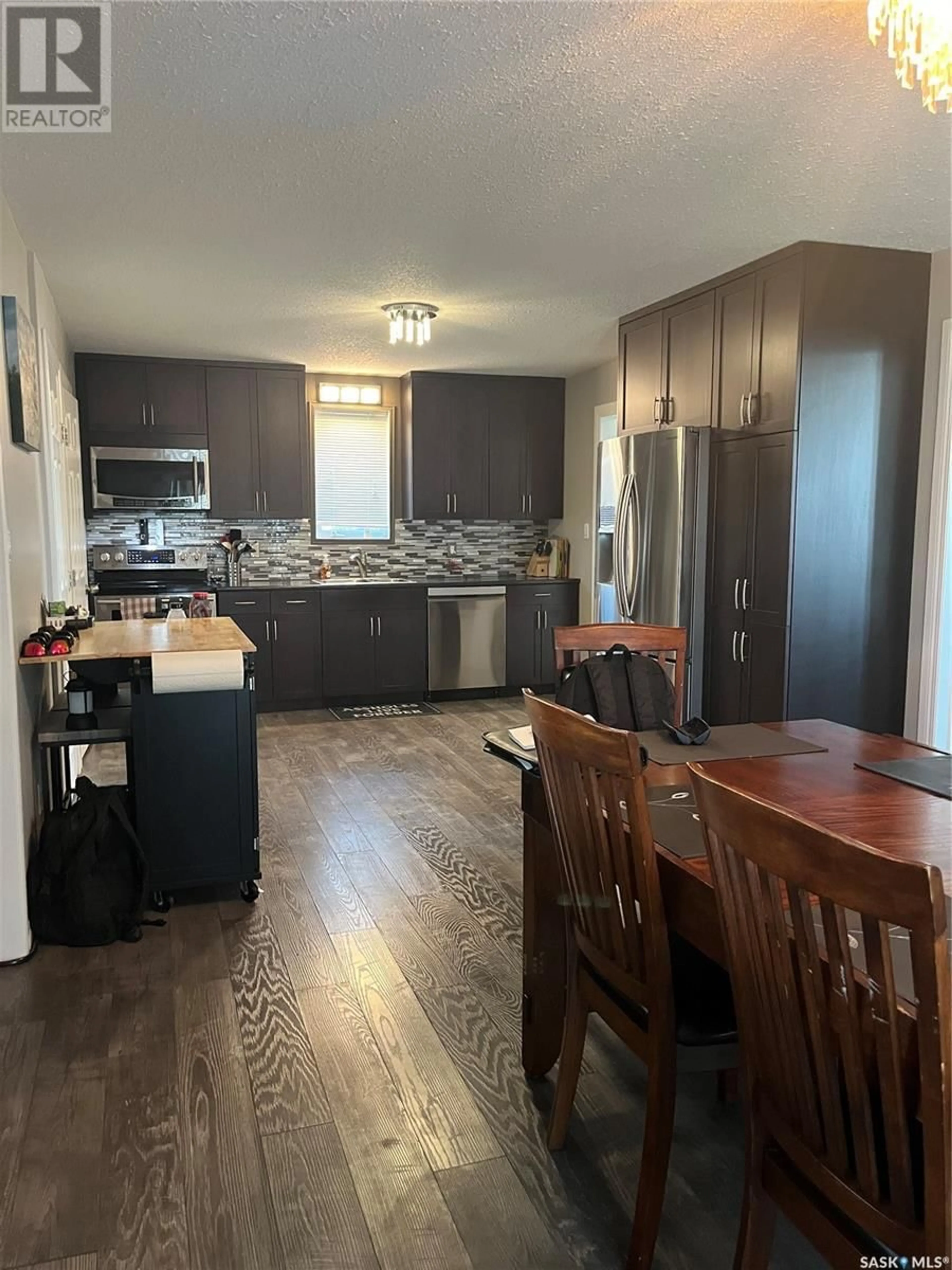 Open concept kitchen, wood/laminate floor for 5004 TELEGRAPH STREET, Macklin Saskatchewan S0L2C0