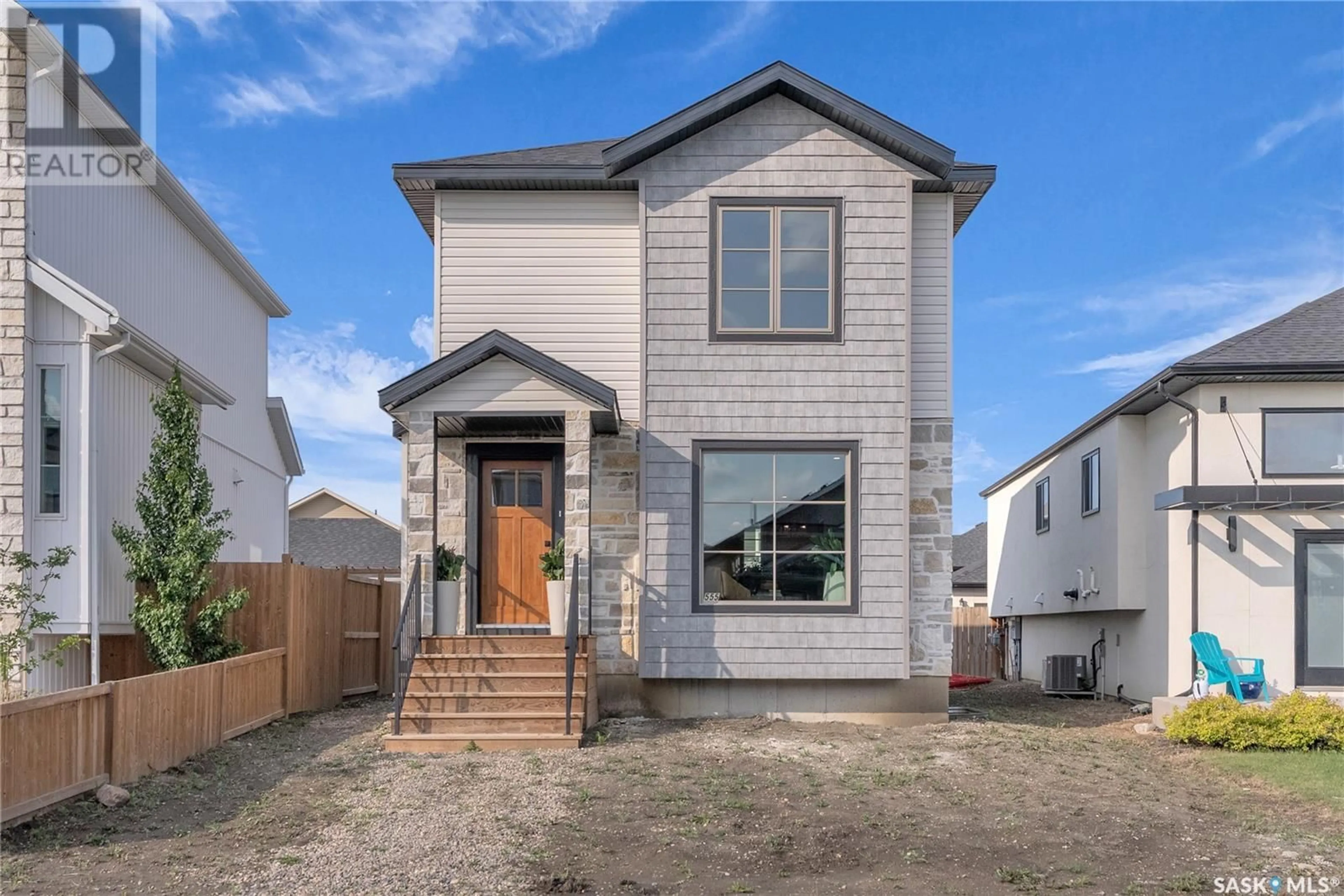 Home with vinyl exterior material, street for 555 FAST WAY, Saskatoon Saskatchewan S7W0X1