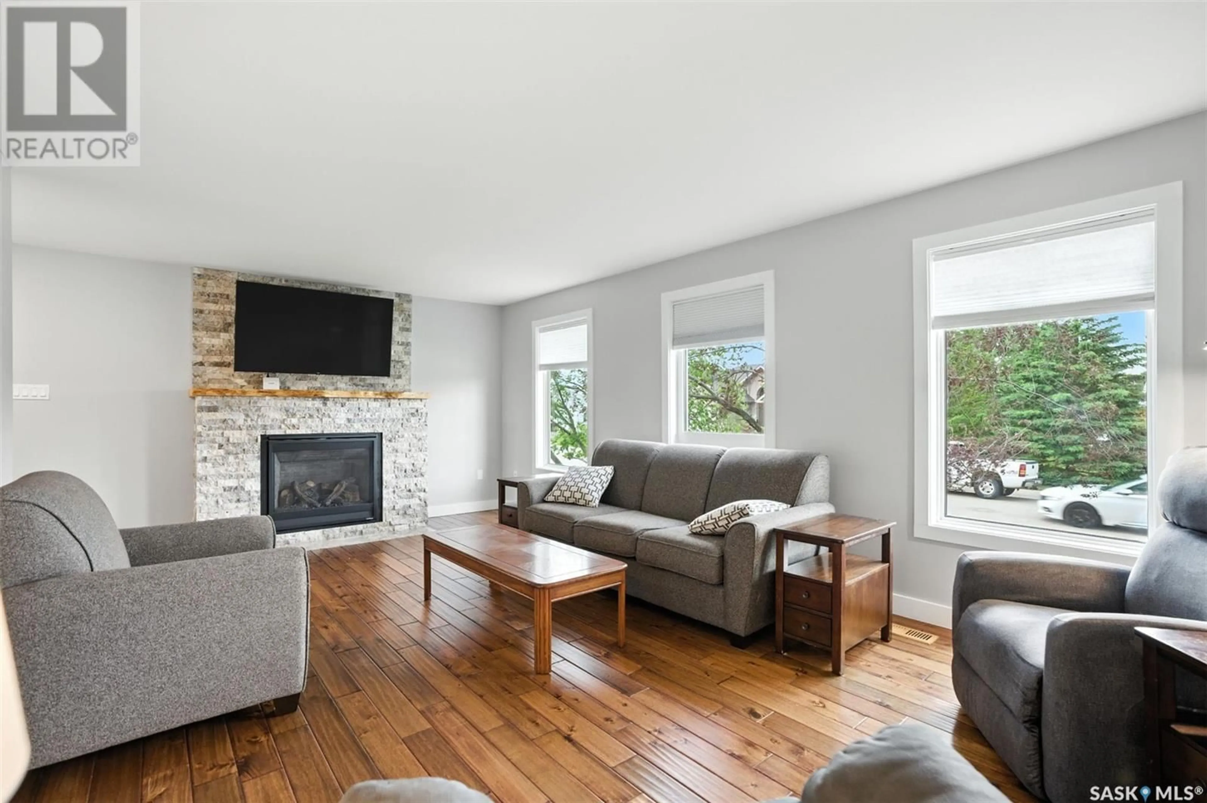 Living room with furniture, wood/laminate floor for 65 HOWARD CRESCENT, Lanigan Saskatchewan S0K2M0