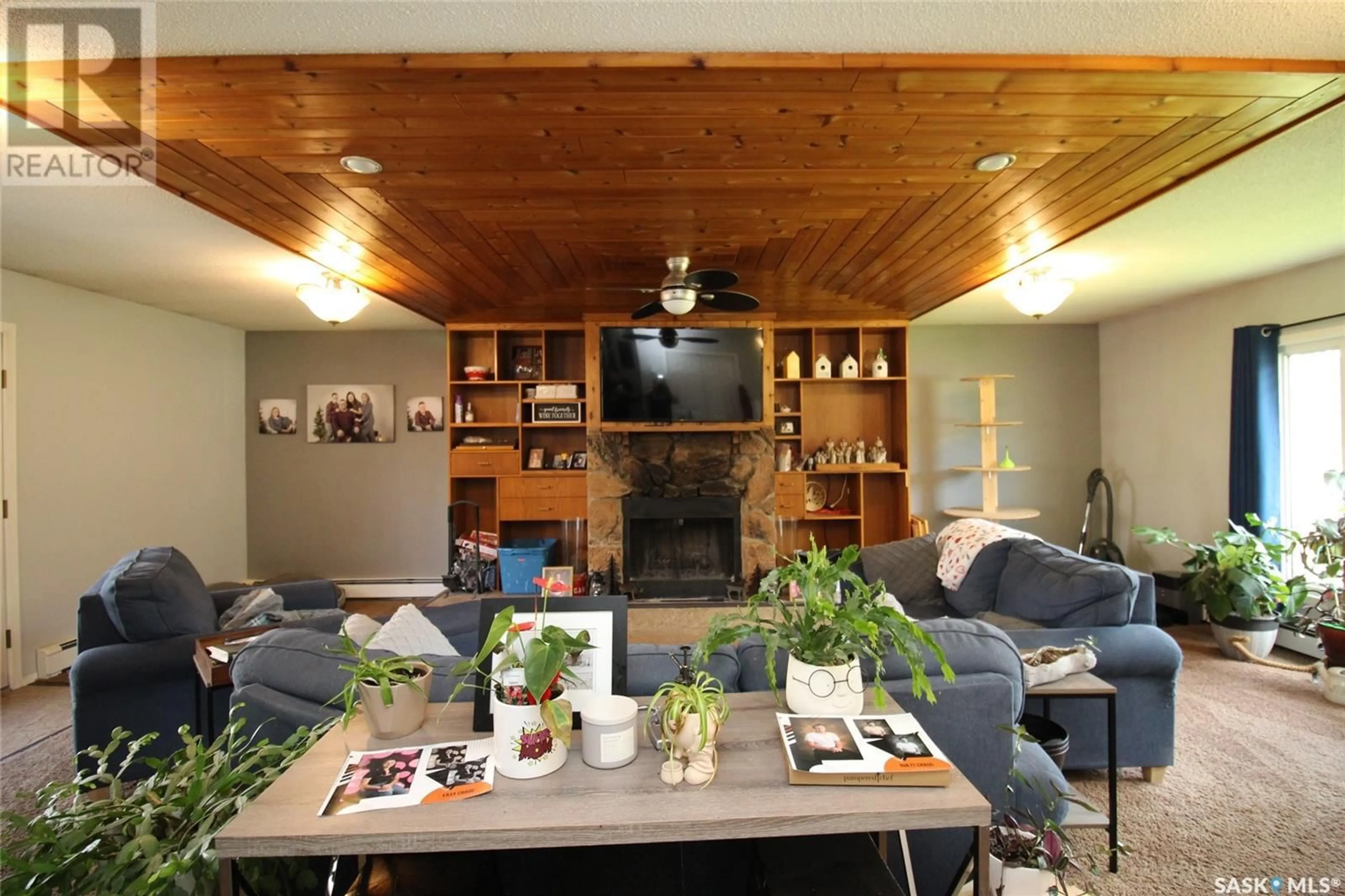 Living room with furniture, wood/laminate floor for 405 4TH AVENUE, Shaunavon Saskatchewan S0N2M0