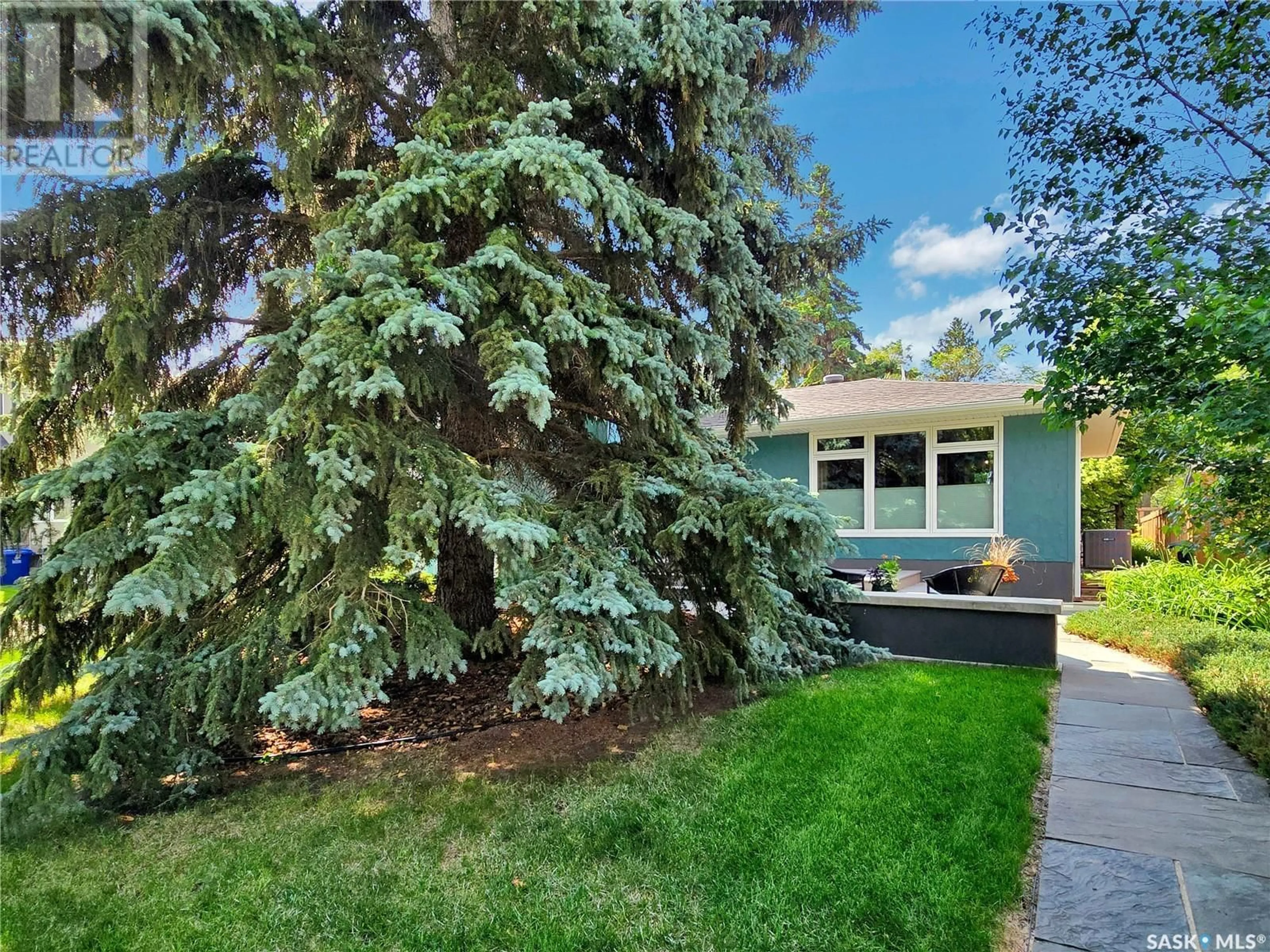 Home with vinyl exterior material, street for 1404 MAIN STREET, Saskatoon Saskatchewan S7H0L6