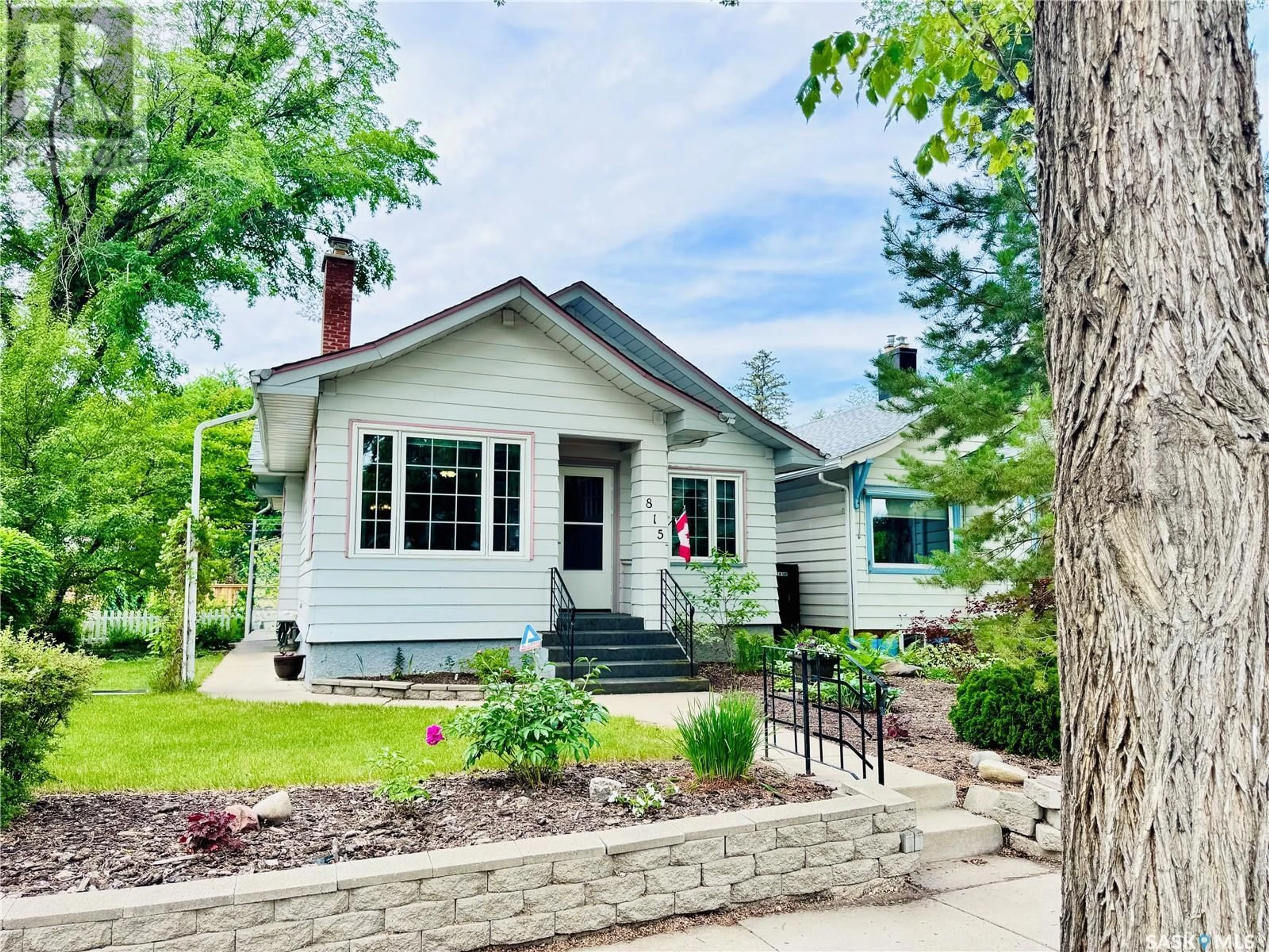 Home with vinyl exterior material, street for 815 TEMPERANCE STREET, Saskatoon Saskatchewan S7N0M8