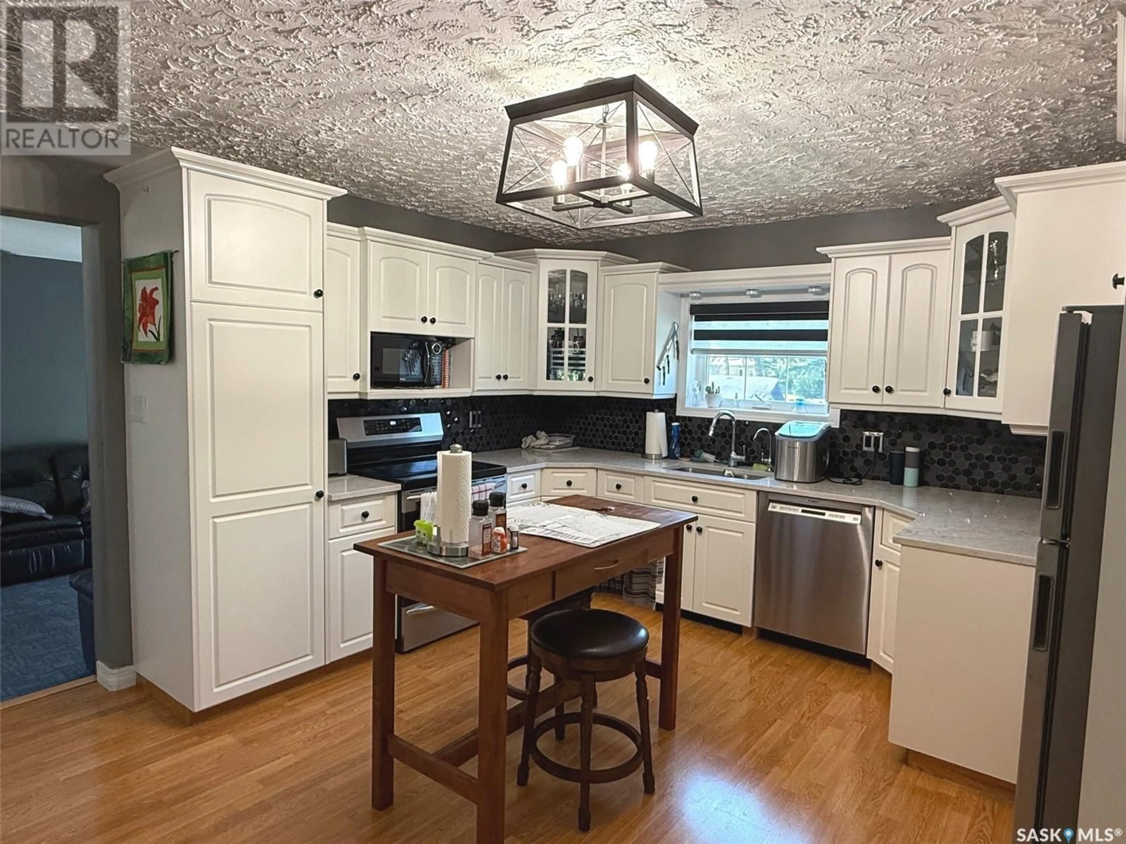 Open concept kitchen, wood/laminate floor for 25 KATEPWA AVENUE, Katepwa Beach Saskatchewan S0G2Y0