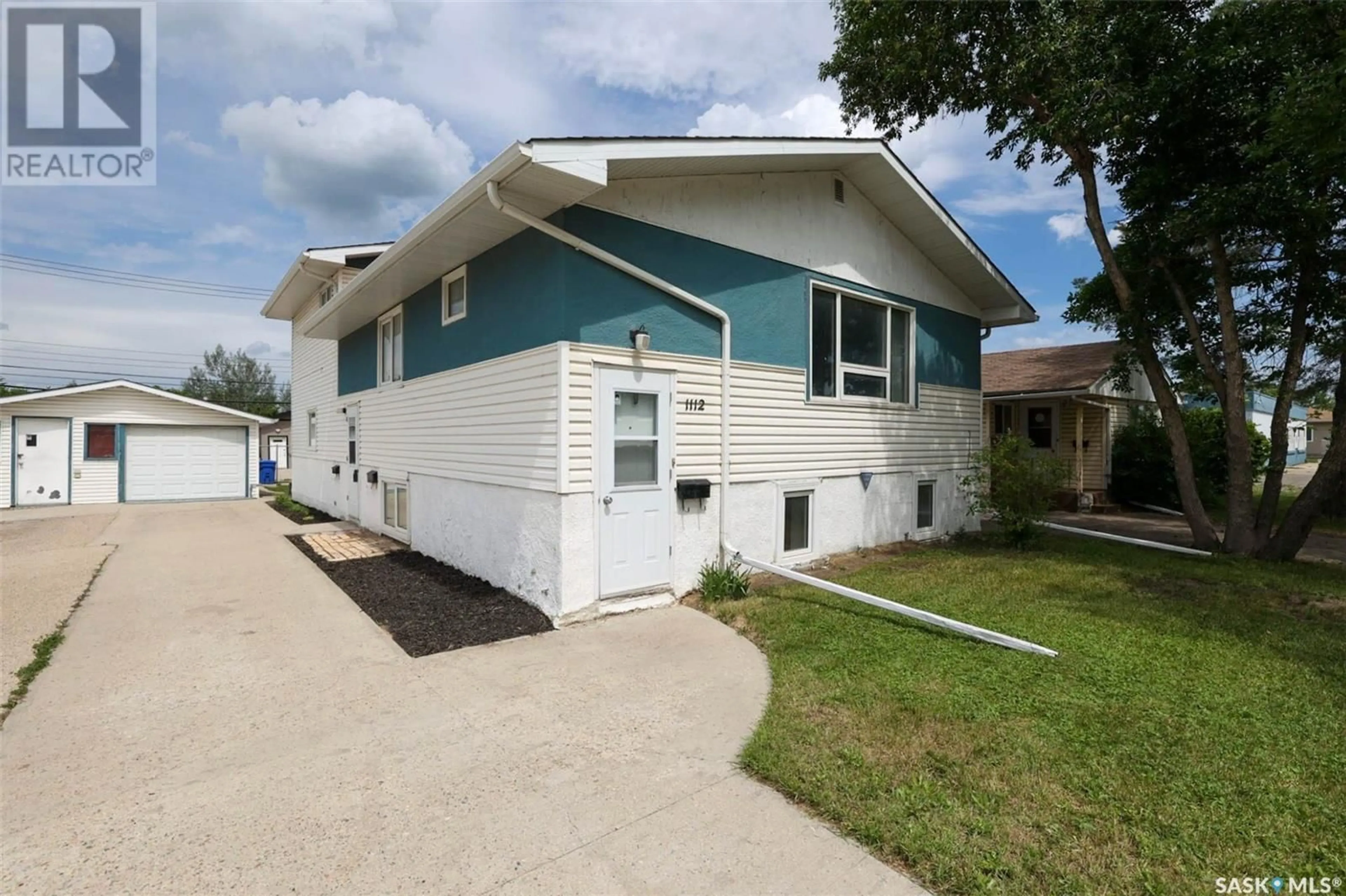 Home with vinyl exterior material, street for E - 1112 DEWDNEY AVENUE, Regina Saskatchewan S4N0E5
