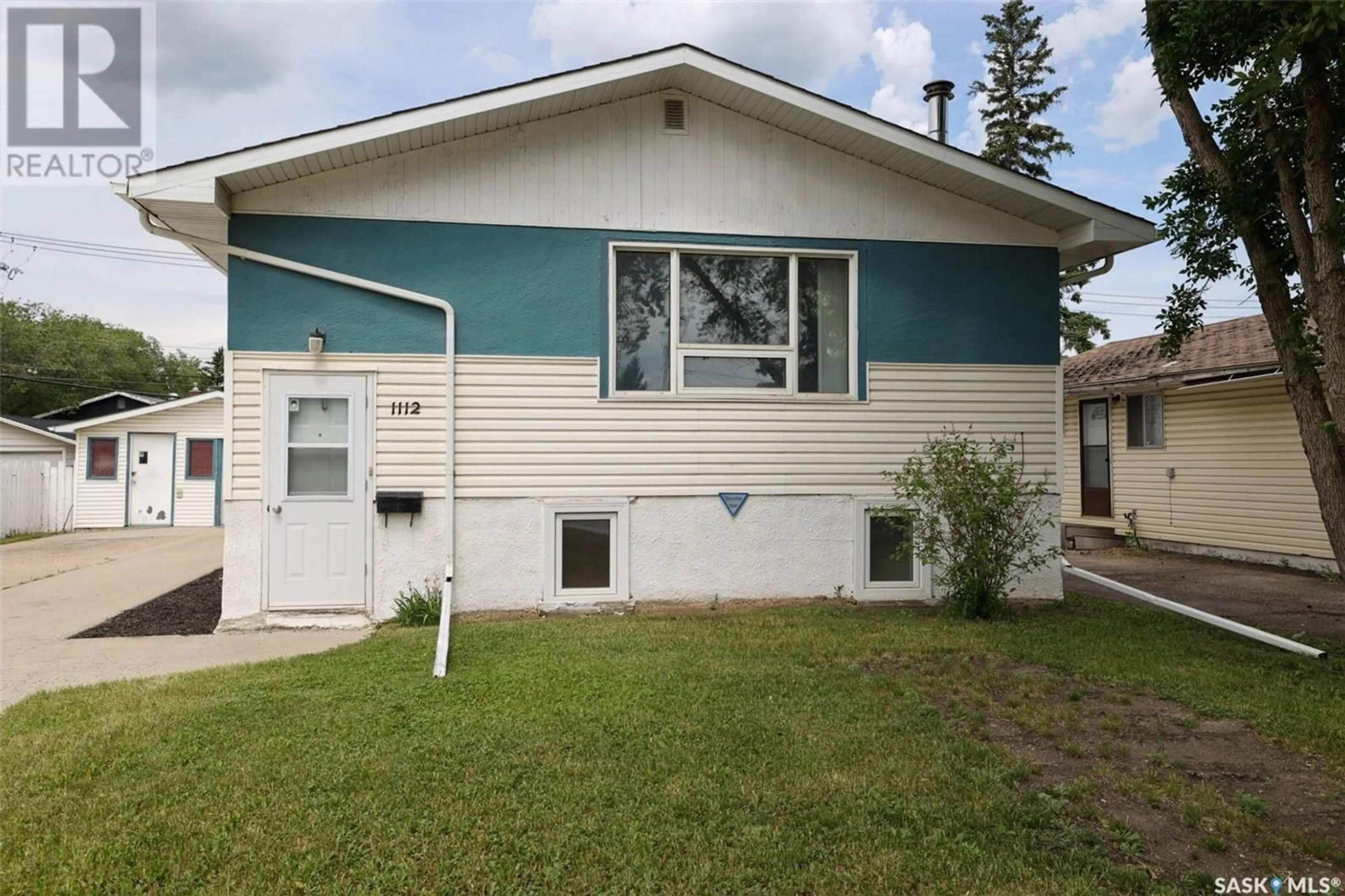 Home with vinyl exterior material, street for E - 1112 DEWDNEY AVENUE, Regina Saskatchewan S4N0E5
