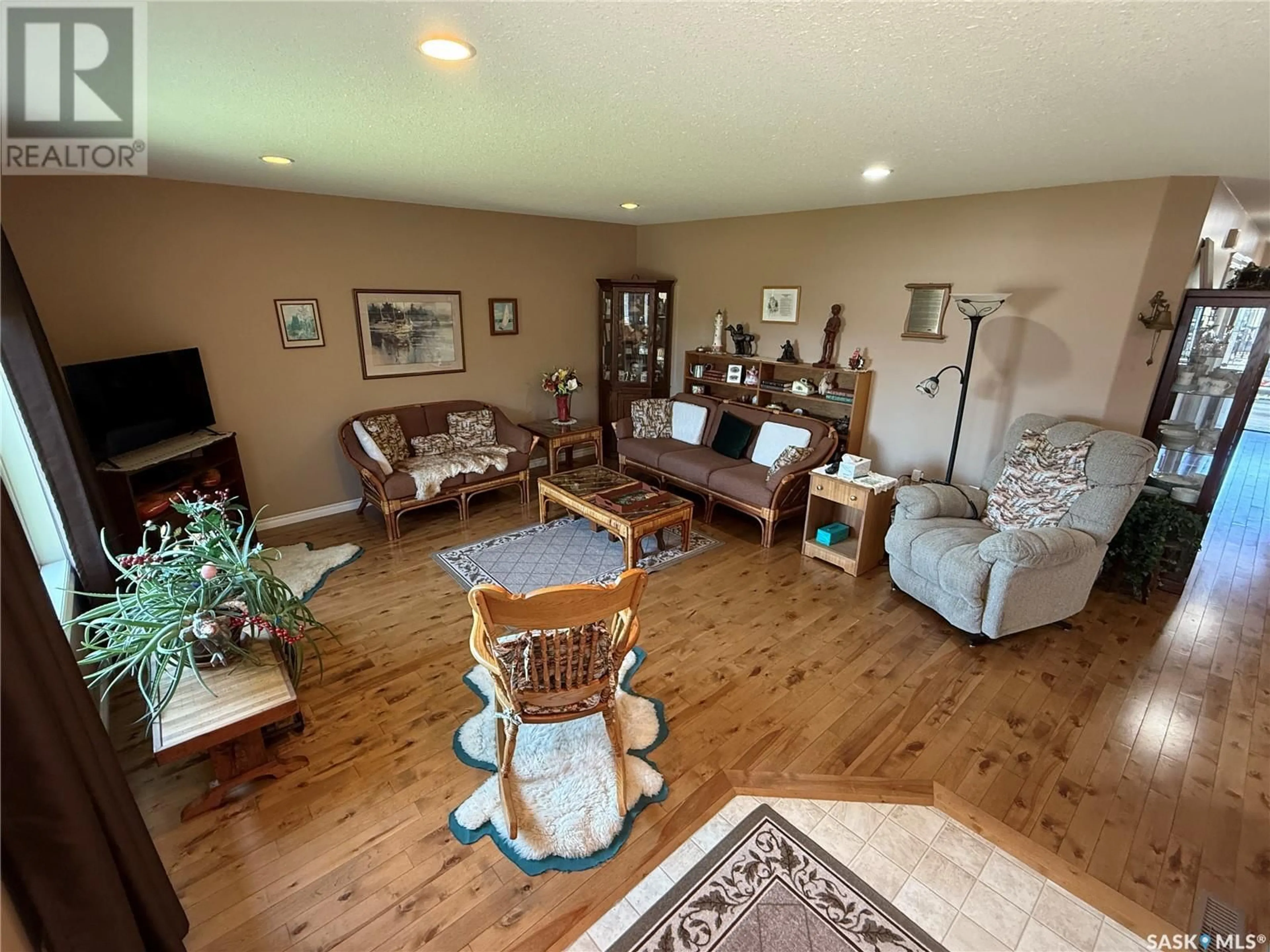 Living room with furniture, wood/laminate floor for 3701 MESA WAY, Shellbrook Saskatchewan S0J2E0