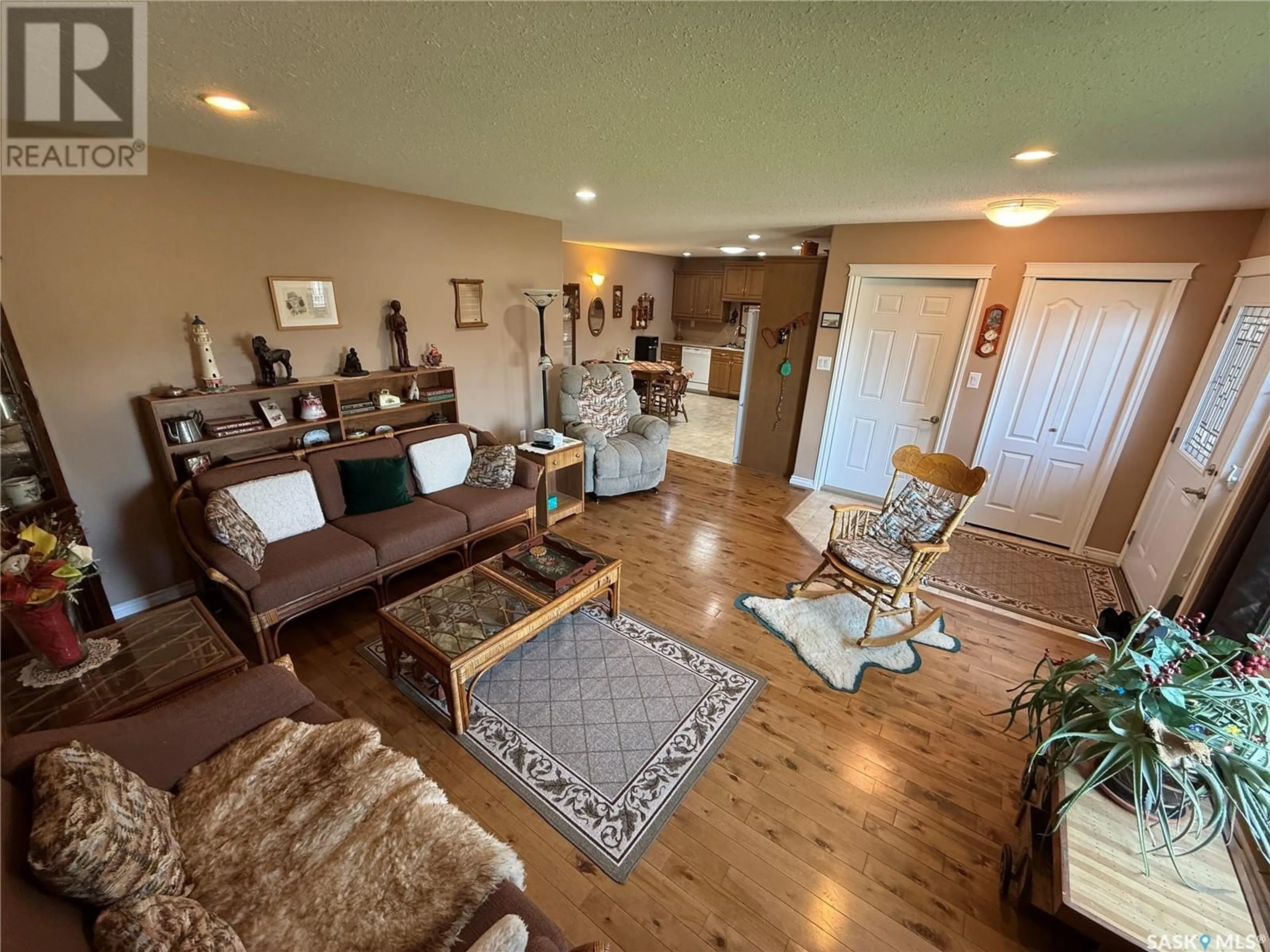 Living room with furniture, wood/laminate floor for 3701 MESA WAY, Shellbrook Saskatchewan S0J2E0