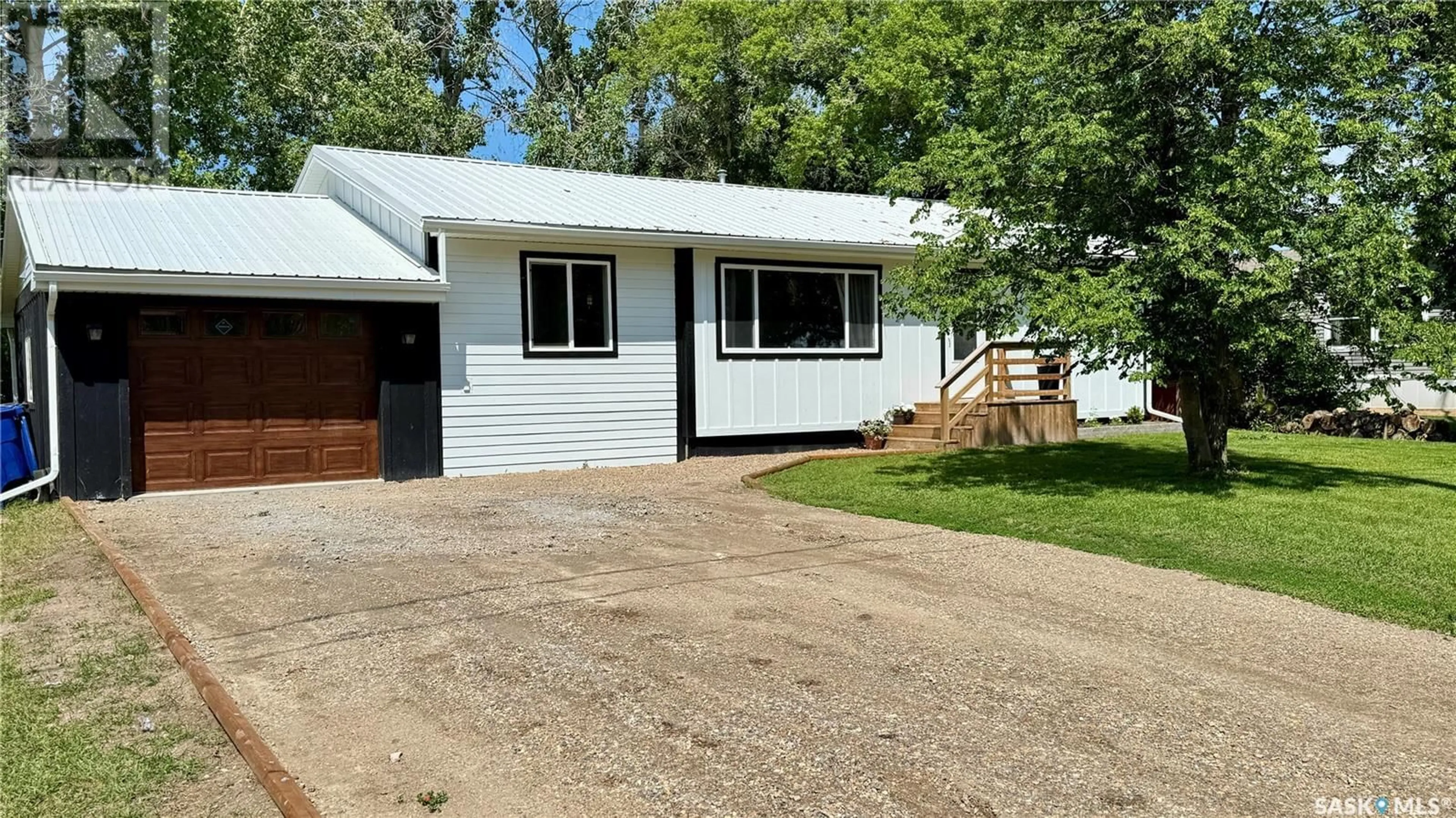 Home with vinyl exterior material, street for 219 KING STREET, Broderick Saskatchewan S0H0L0