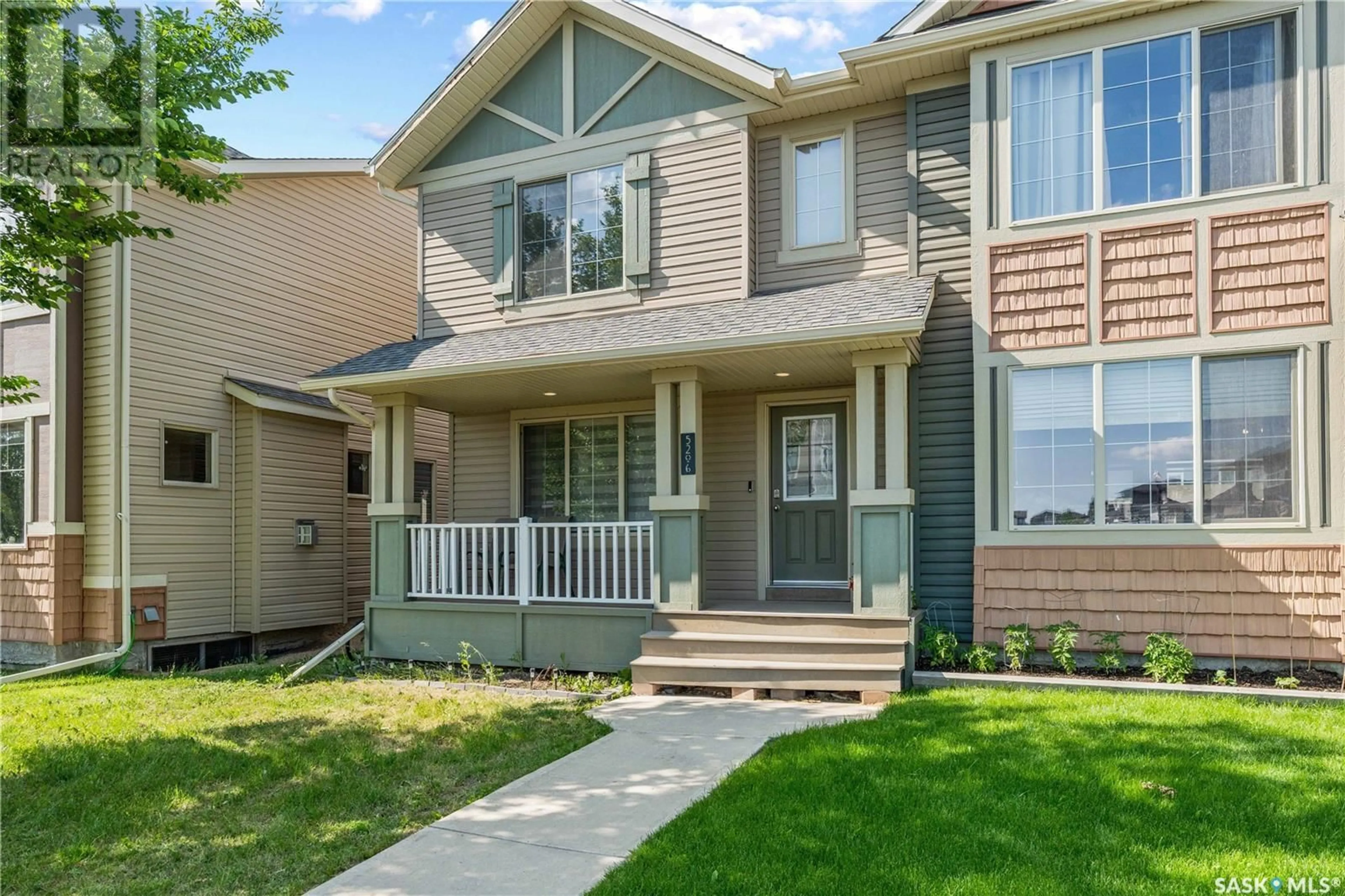Home with vinyl exterior material, street for 5206 MITCHINSON WAY, Regina Saskatchewan S4W0J9