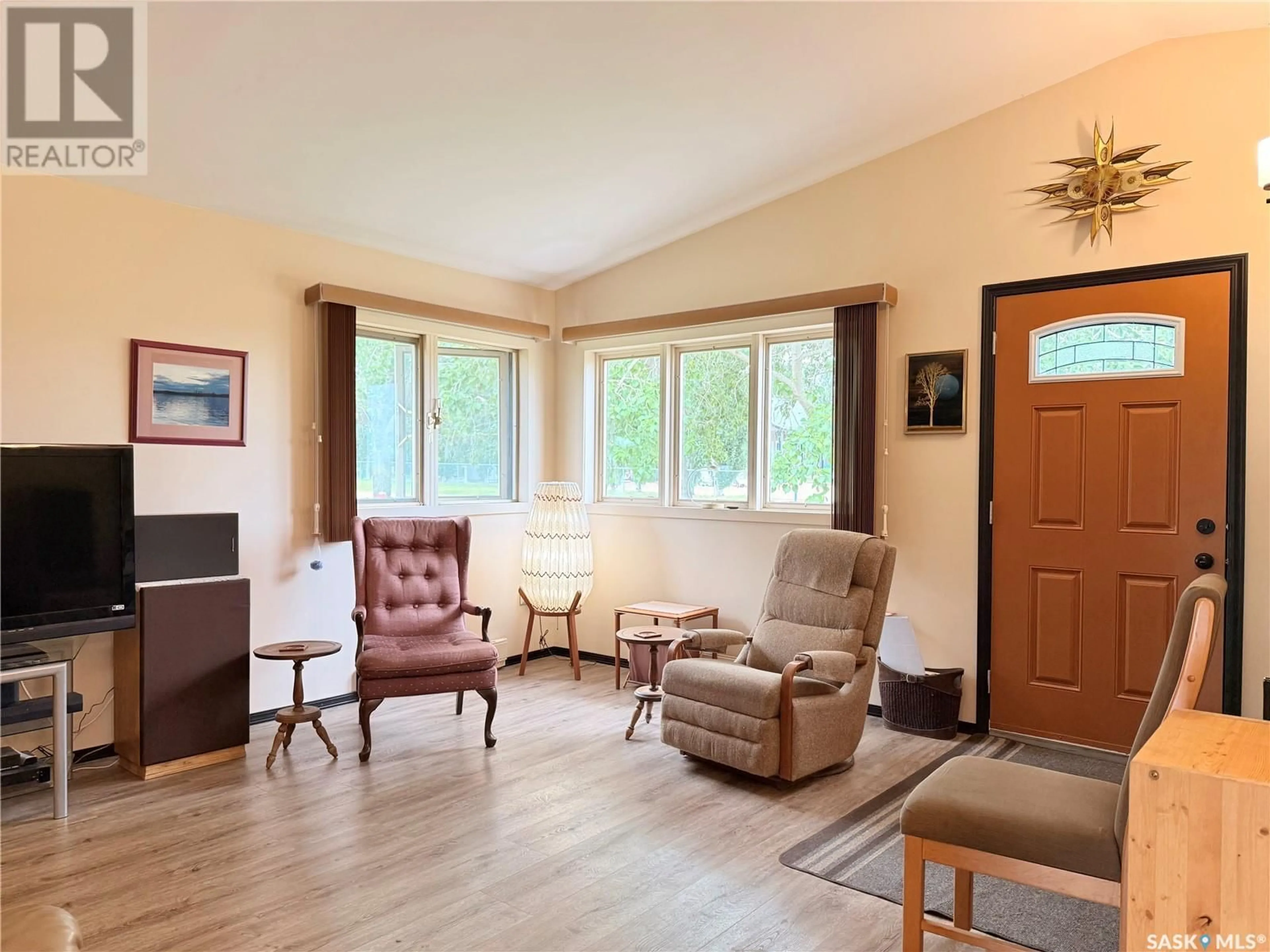 Living room with furniture, wood/laminate floor for 457 2ND AVENUE, Riverhurst Saskatchewan S0H3P0