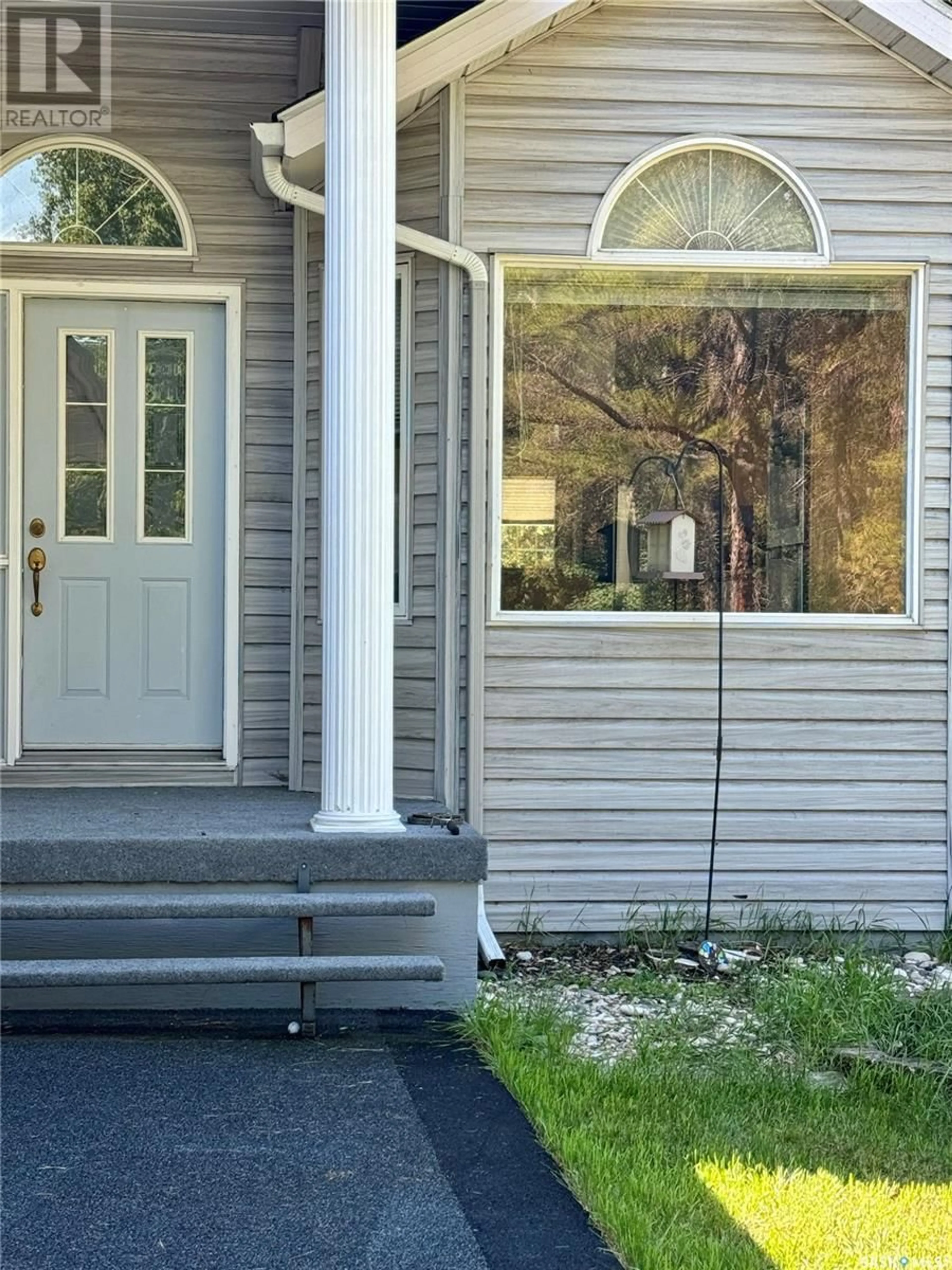 Home with vinyl exterior material, street for 1105 HALPIN PLACE, Hudson Bay Saskatchewan S0E0Y0