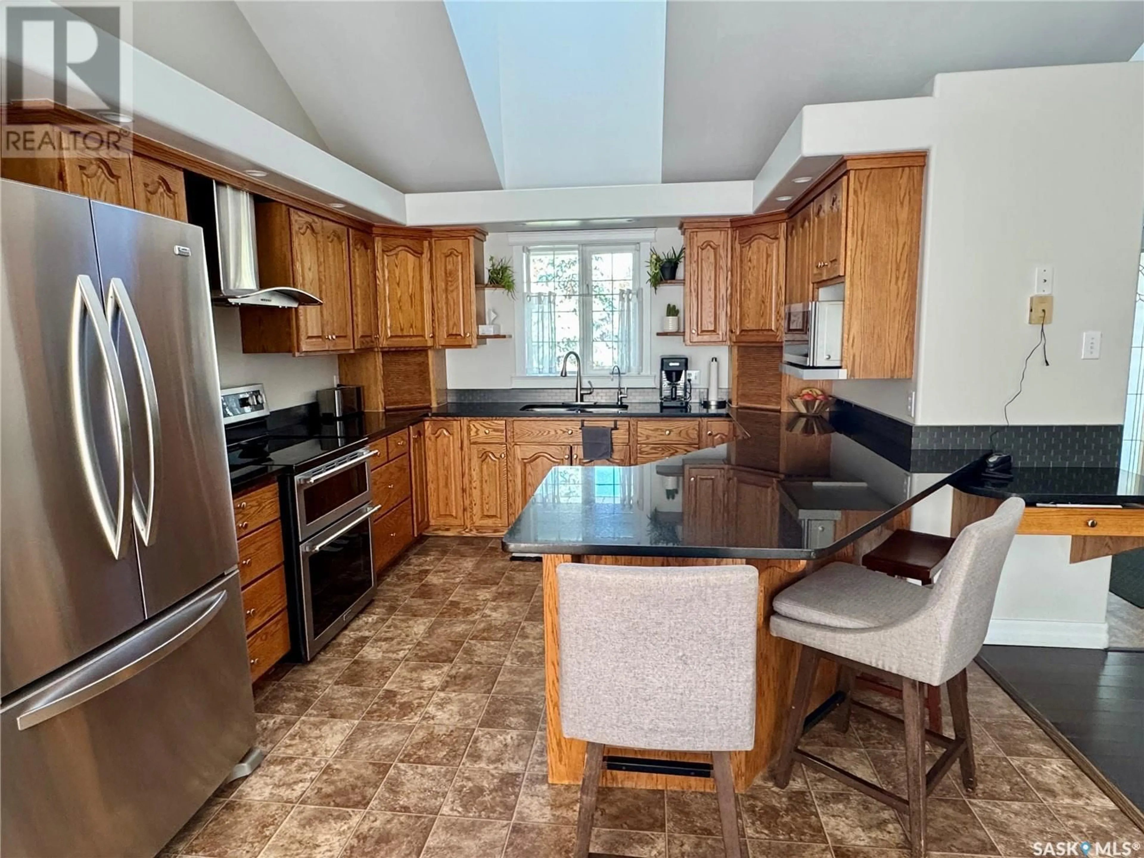 Open concept kitchen, ceramic/tile floor for 936 THOMPSON CRESCENT, La Ronge Saskatchewan S0J1L0