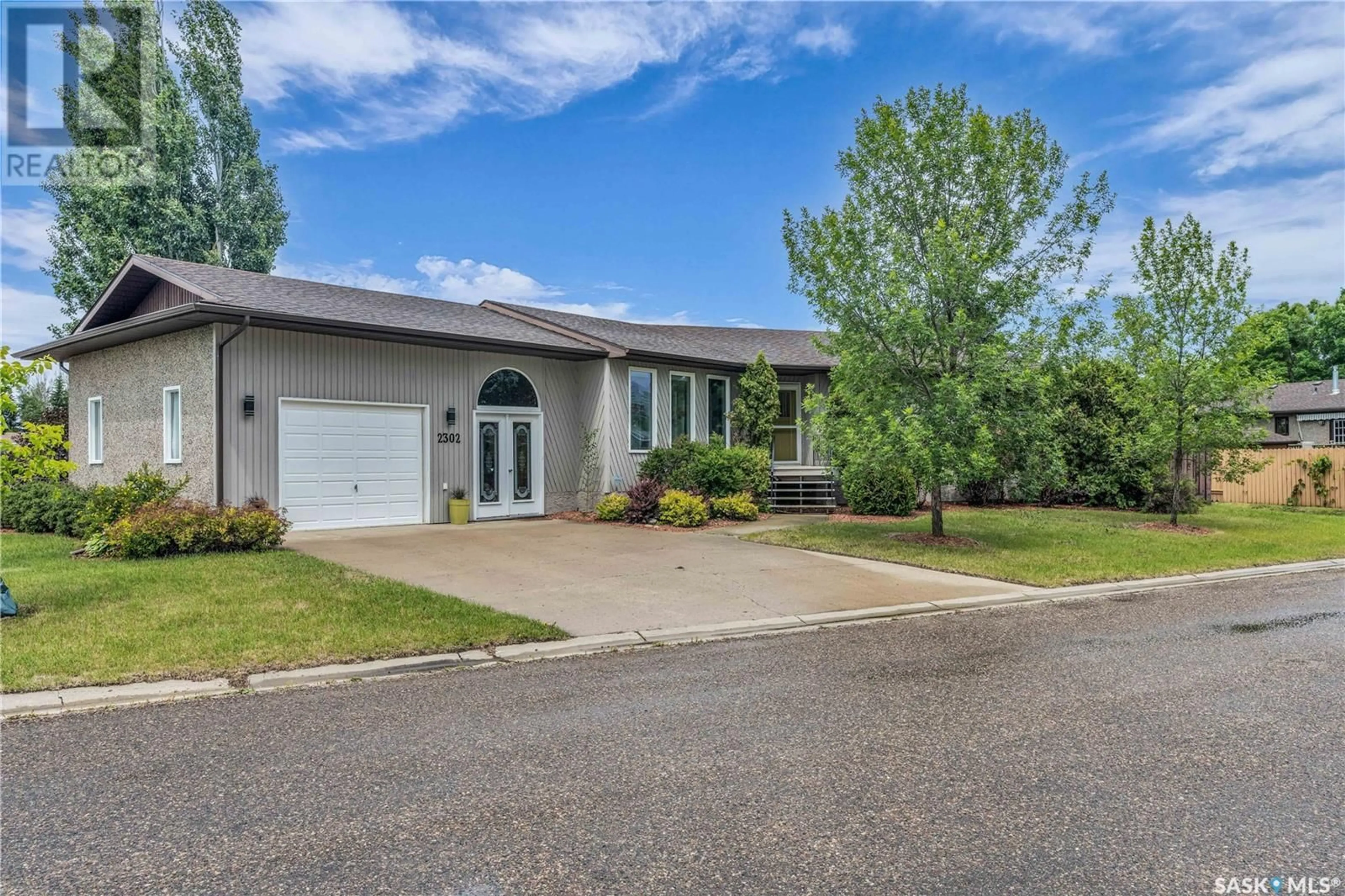 Home with vinyl exterior material, street for 2302 MEADOW LARK LANE, North Battleford Saskatchewan S9A3V2