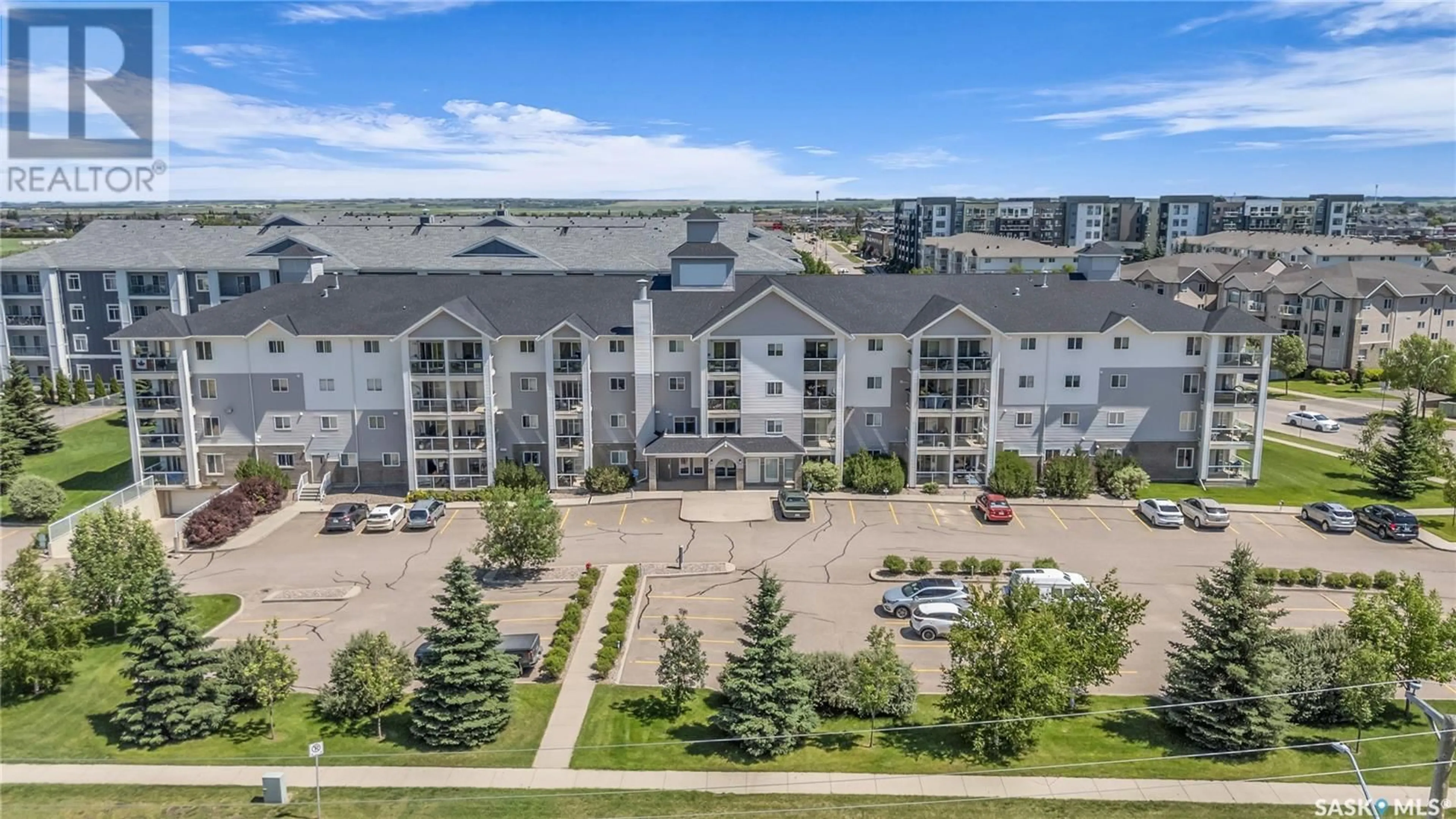 A pic from outside/outdoor area/front of a property/back of a property/a pic from drone, city buildings view from balcony for 303 - 105 LOWE ROAD, Saskatoon Saskatchewan S7S1P2