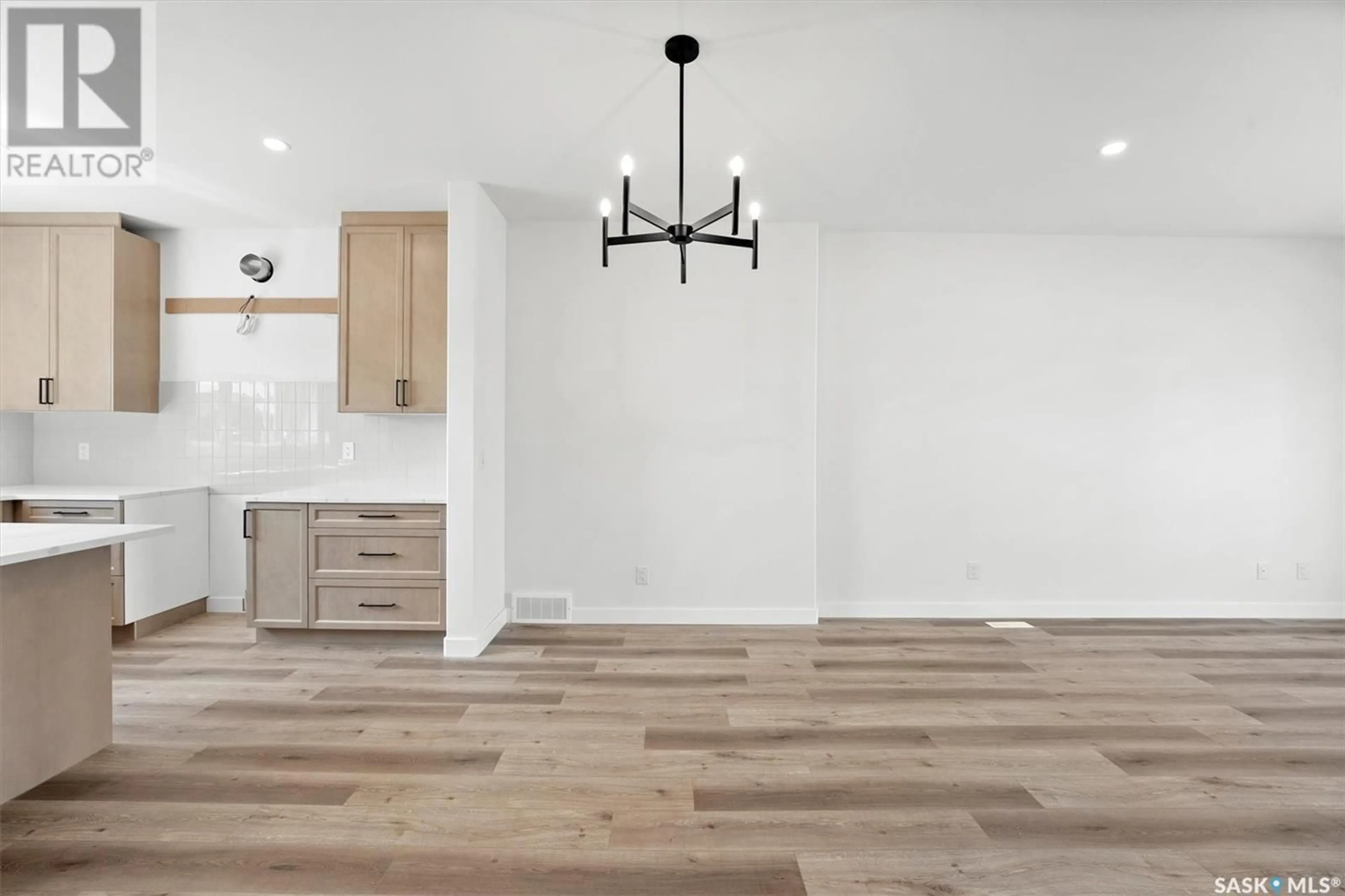 Open concept kitchen, wood/laminate floor for 429 ELDORADO STREET, Warman Saskatchewan S0K4S3